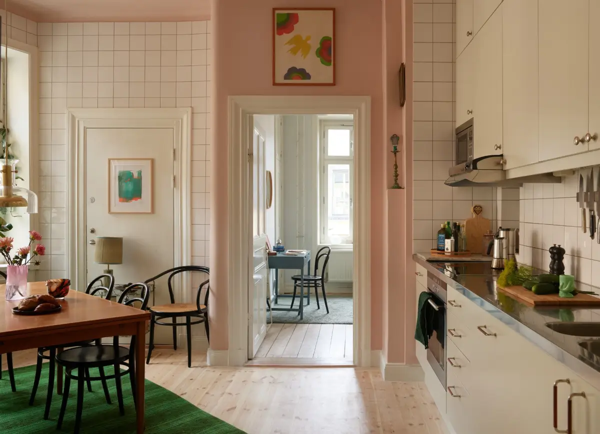 A Spacious Family Apartment with Original Details in Stockholm 14 kitchen with light pink and white-tiled walls