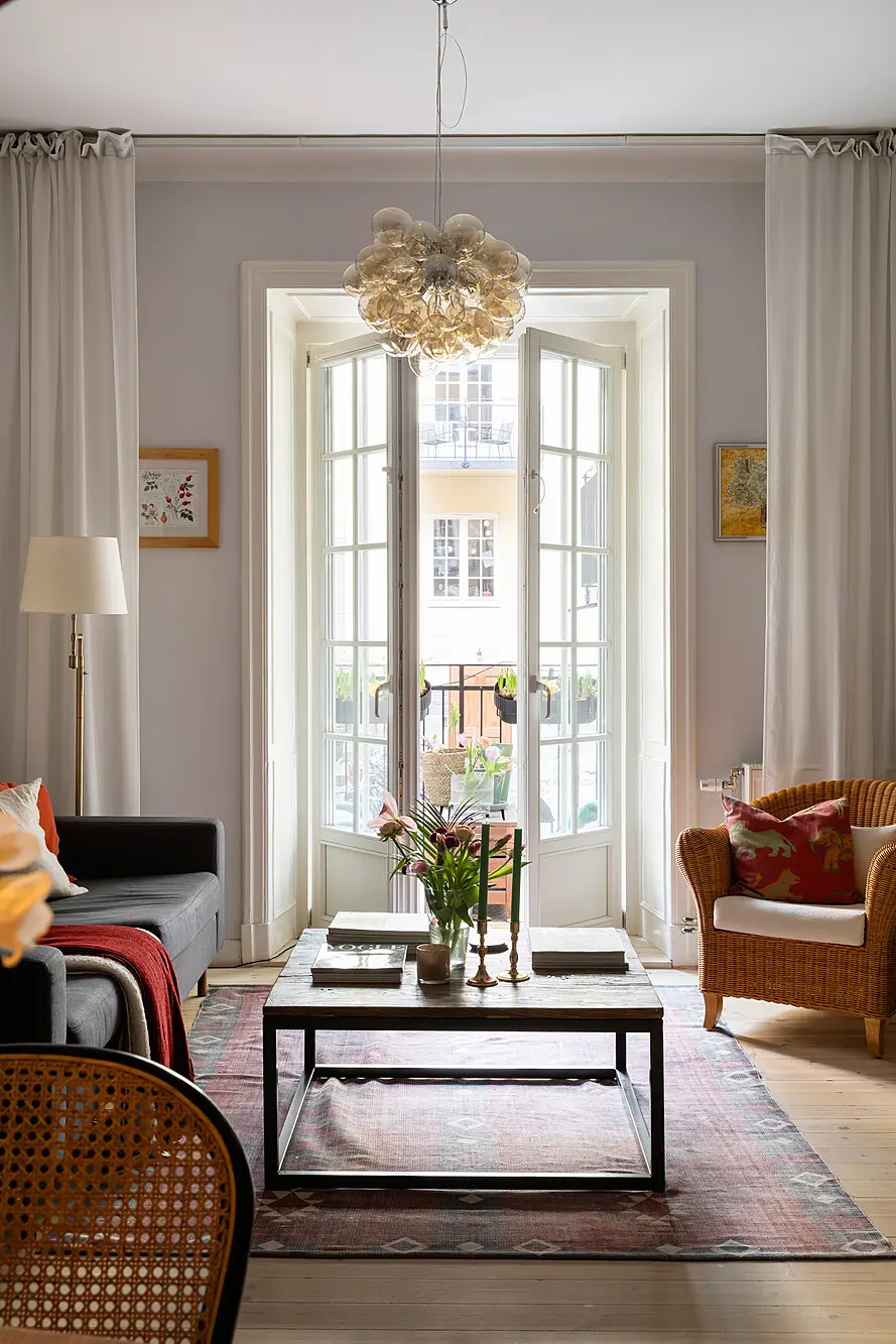 Red and Blue Color Accents in an Open-Plan Stockholm Apartment 4 light gray living room glass balcony doors nordroom