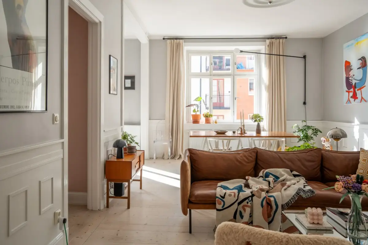 A Light Turn-of-the-Century Apartment with a Blue Kitchen 5 light gray scandinavian living room