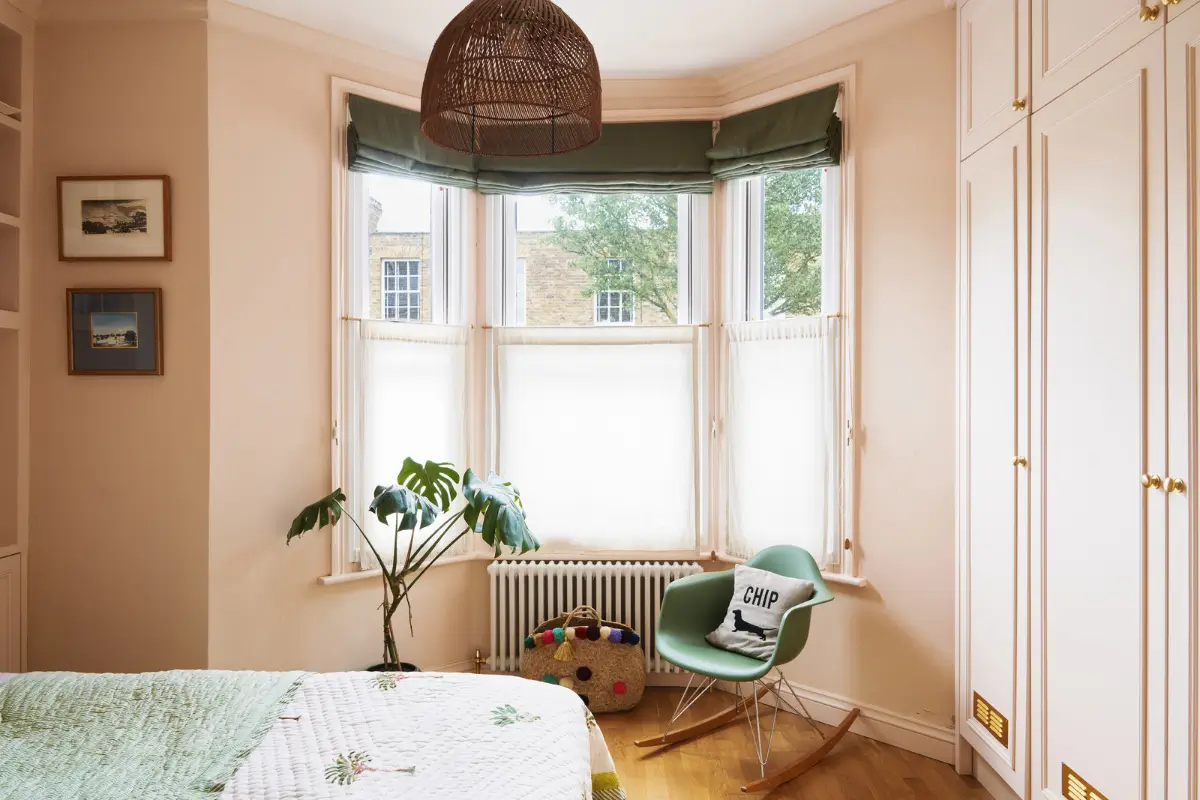 An Extended Victorian Apartment with Exposed Brick Walls 14 light pink bedroom bay window