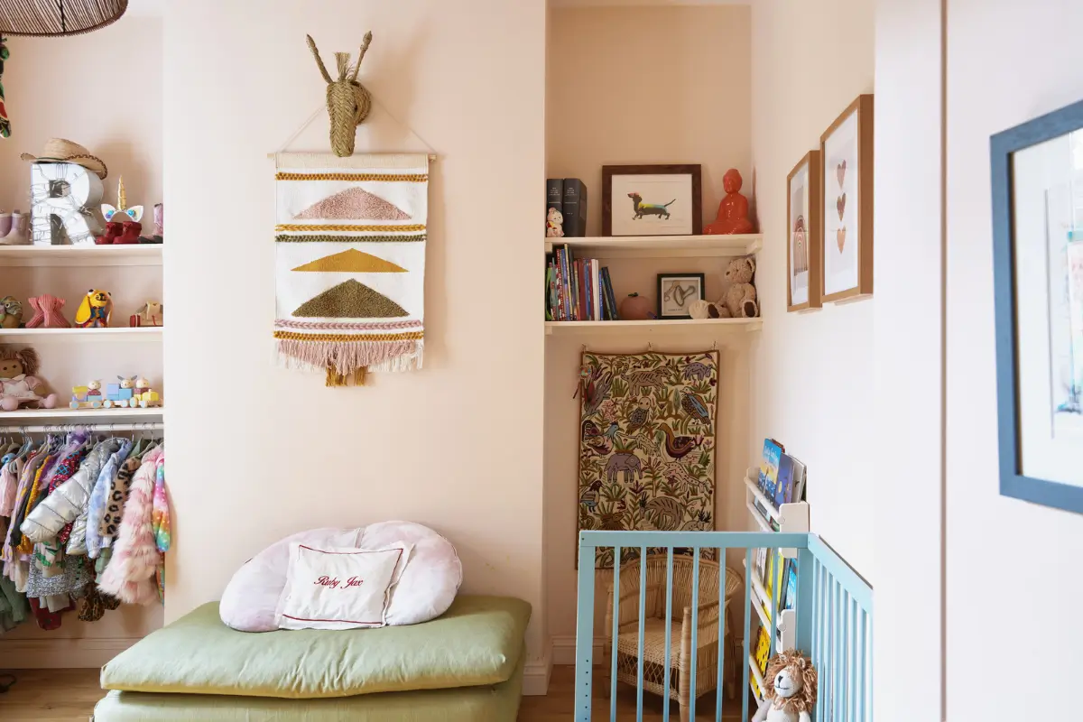An Extended Victorian Apartment with Exposed Brick Walls 11 light pink nursery with shelves
