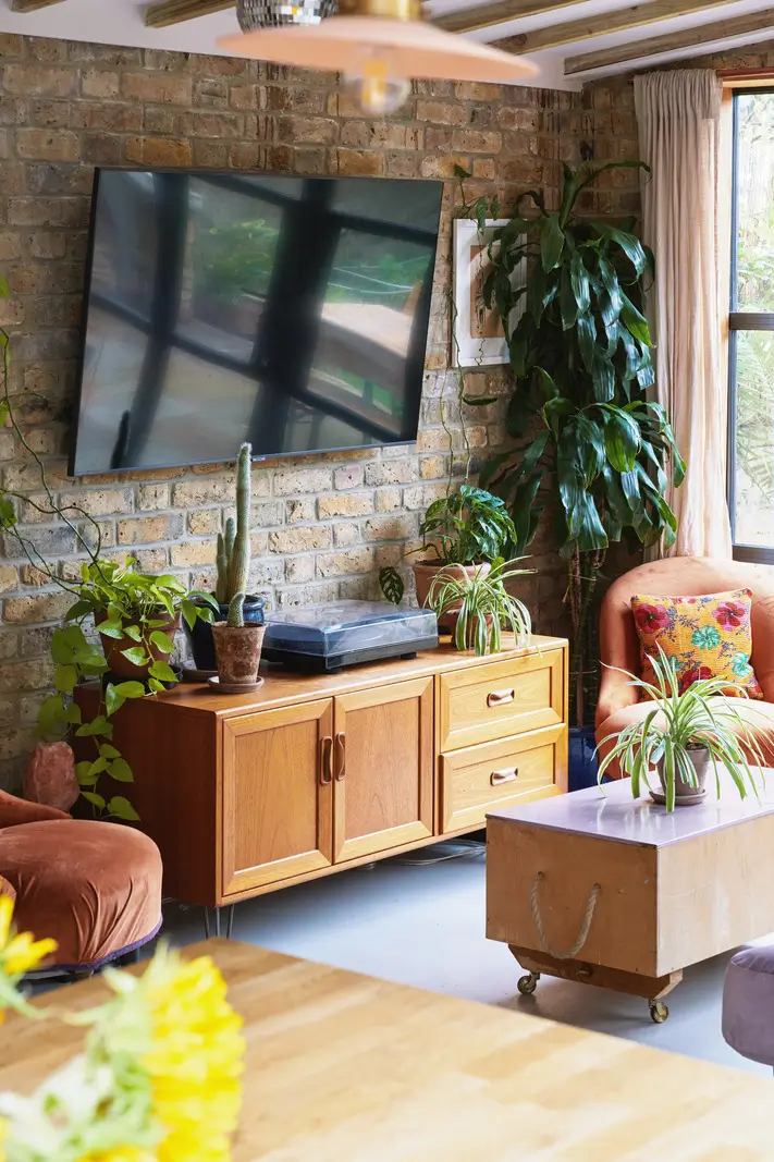 An Extended Victorian Apartment with Exposed Brick Walls 4 living room brick wall wooden beams