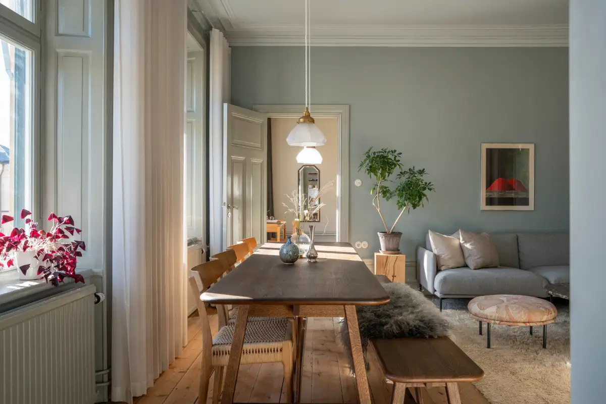 Historic Elegance and a French-Style Kitchen and Bathroom in a Stockholm Apartment 7 living room dining table with bench nordroom