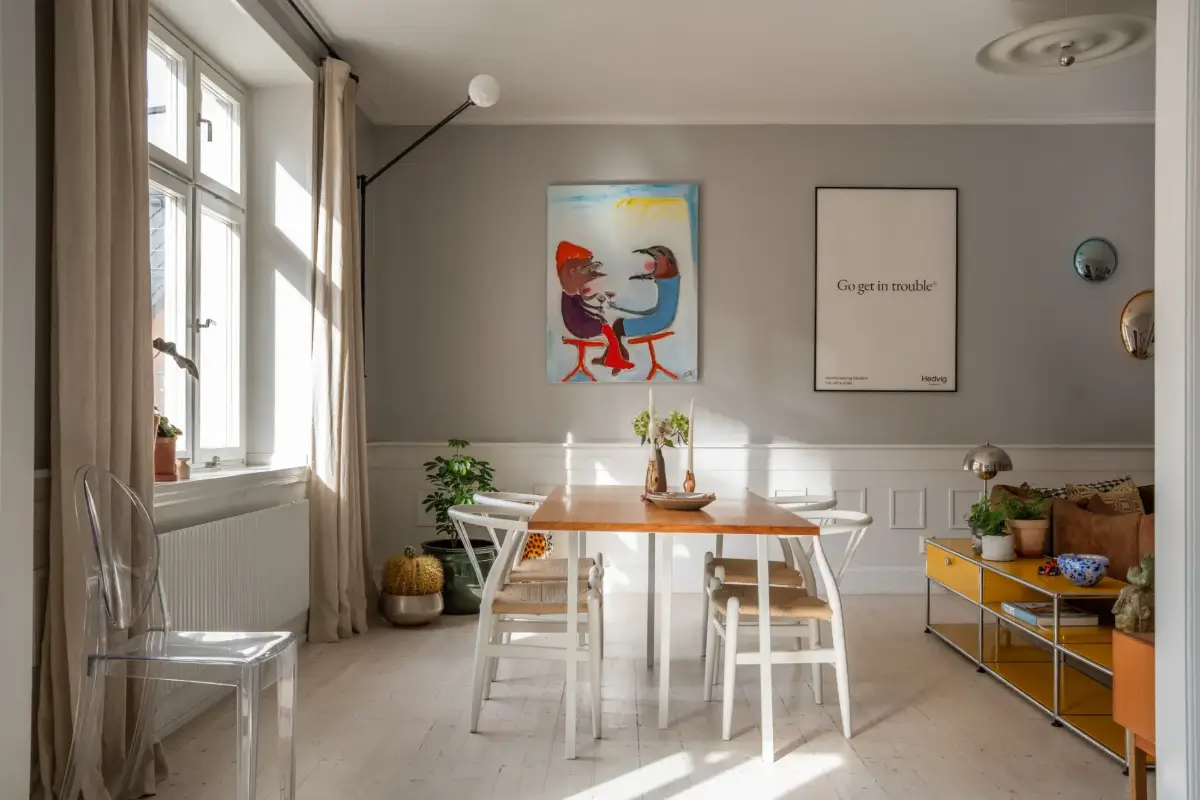 A Light Turn-of-the-Century Apartment with a Blue Kitchen 7 living room dining table