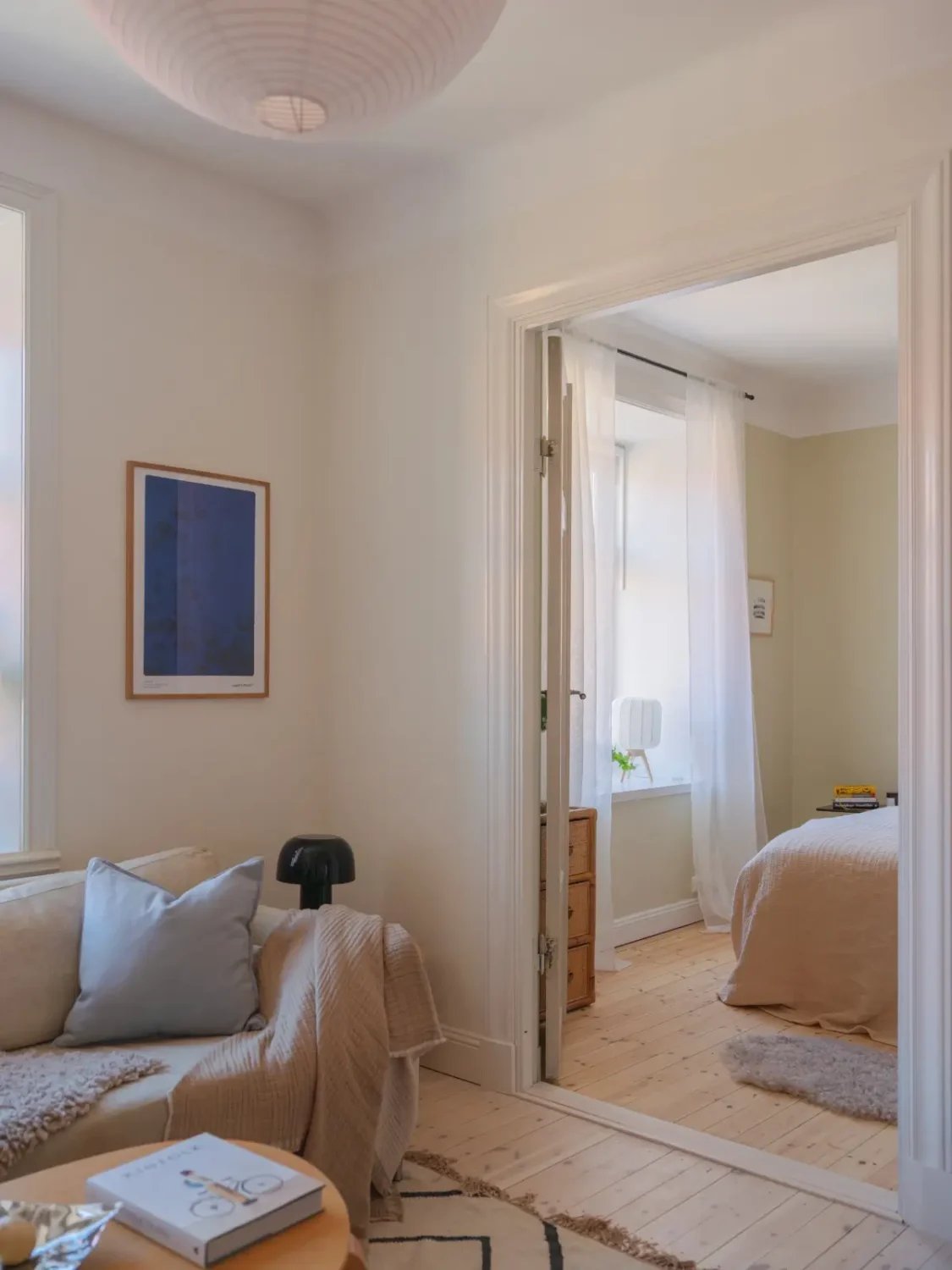 A Bright Apartment Where Historic Character Meets Contemporary Design 9 living room double doors to bedroom