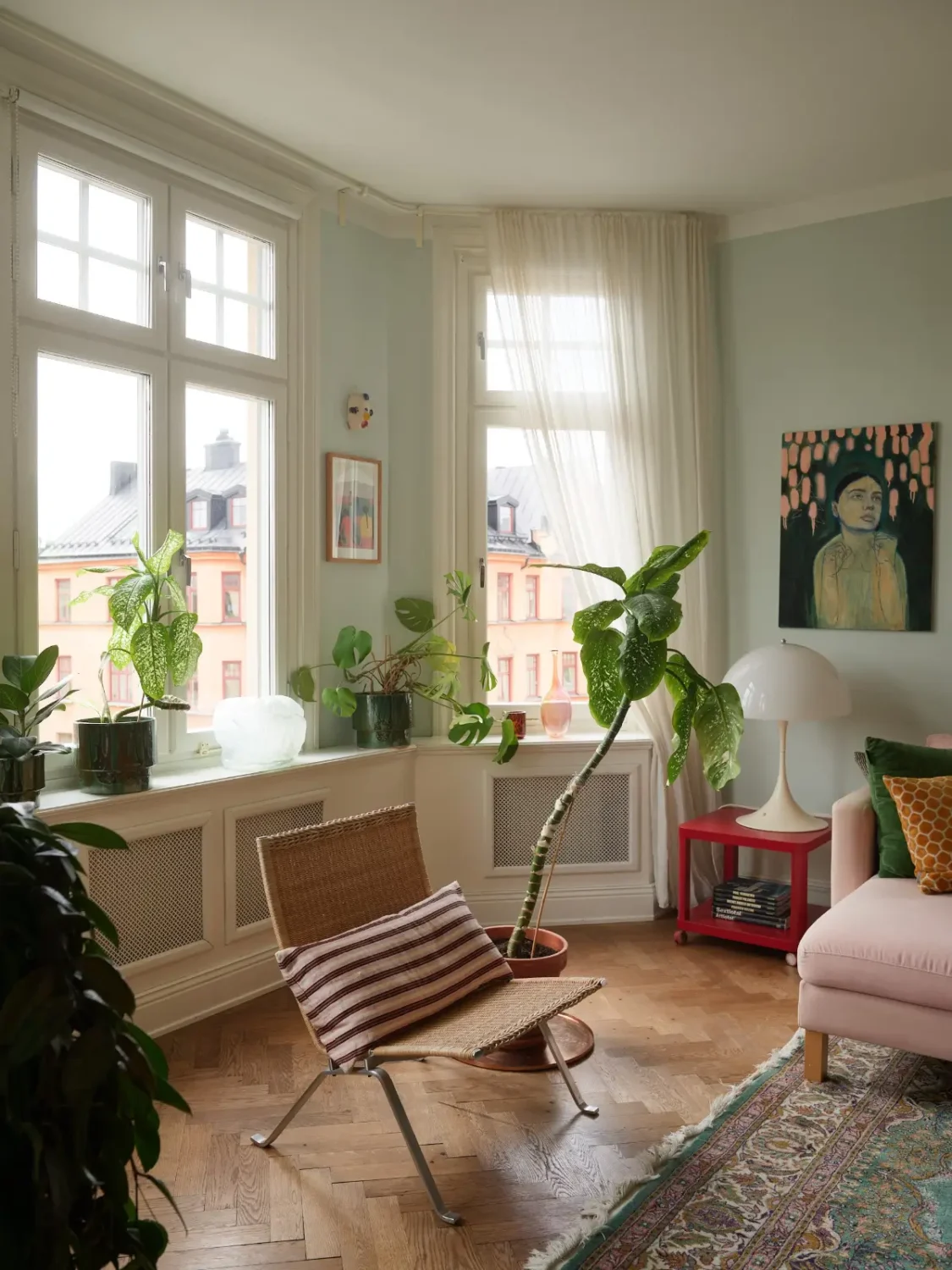 A Spacious Family Apartment with Original Details in Stockholm 2 living room herringbone parquet floor bay window