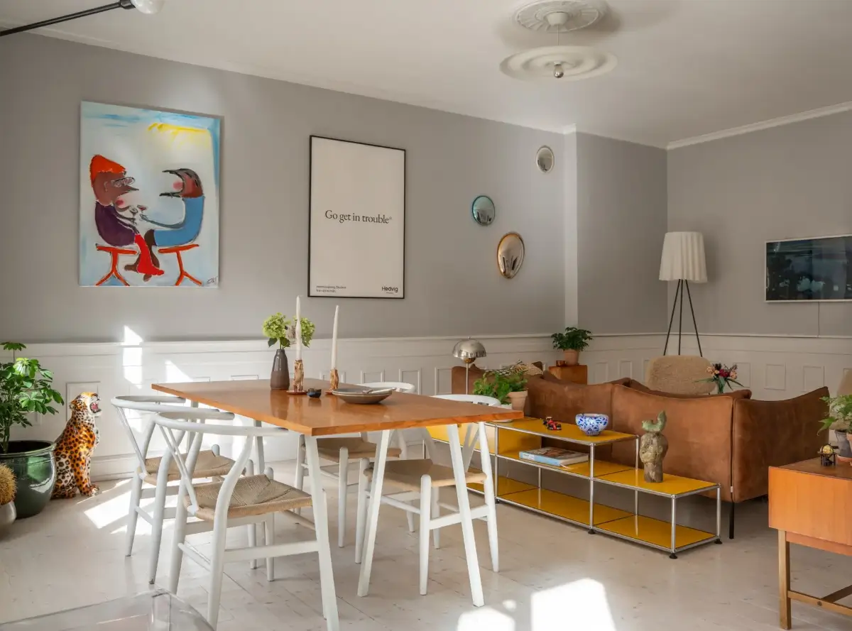 A Light Turn-of-the-Century Apartment with a Blue Kitchen 6 living room high baseboards light gray walls