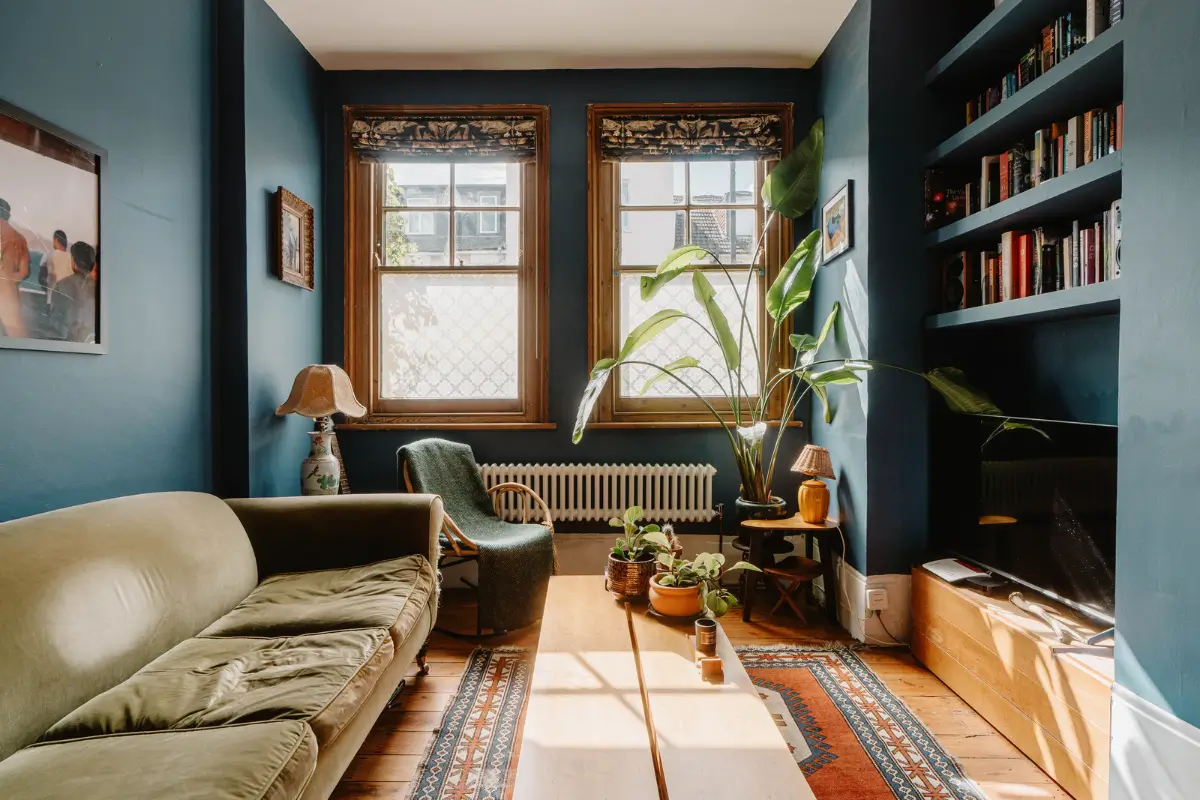 Shades of Blue and Original Details in a Victorian Garden Apartment 1 living room large windows dark blue walls