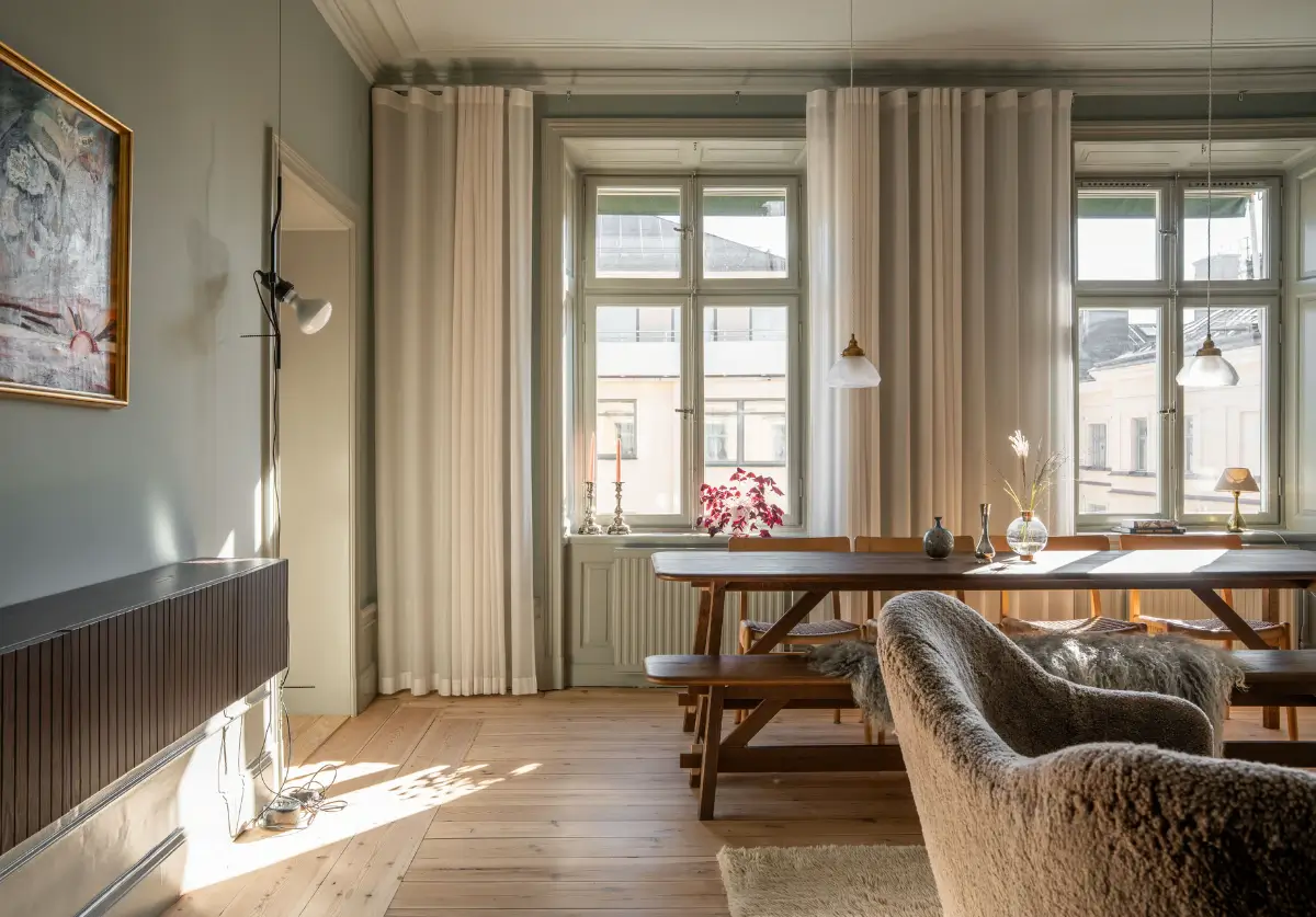 Historic Elegance and a French-Style Kitchen and Bathroom in a Stockholm Apartment 10 living room large windows wooden floorboards
