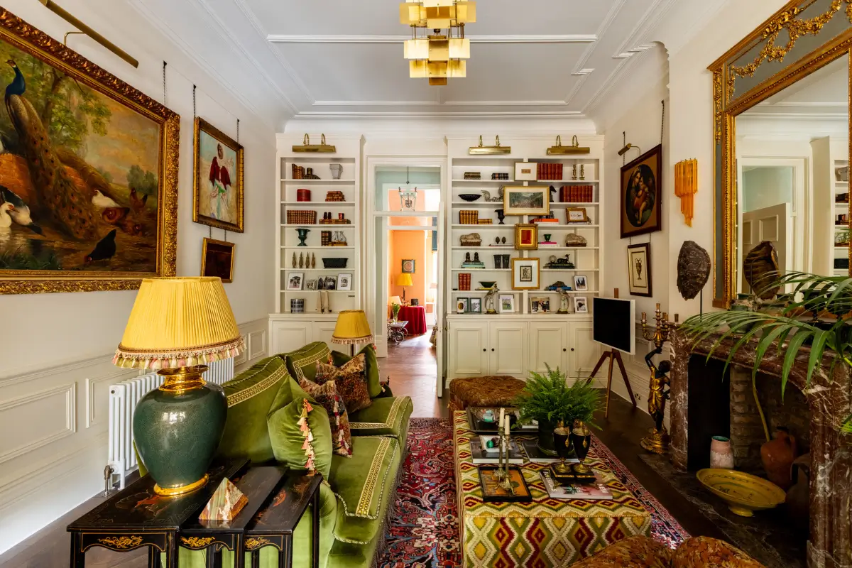 A Mixture of Patterns, Colors, and Materials in a Stunning London Apartment 3 living room marble fireplace built-in bookshelves nordroom