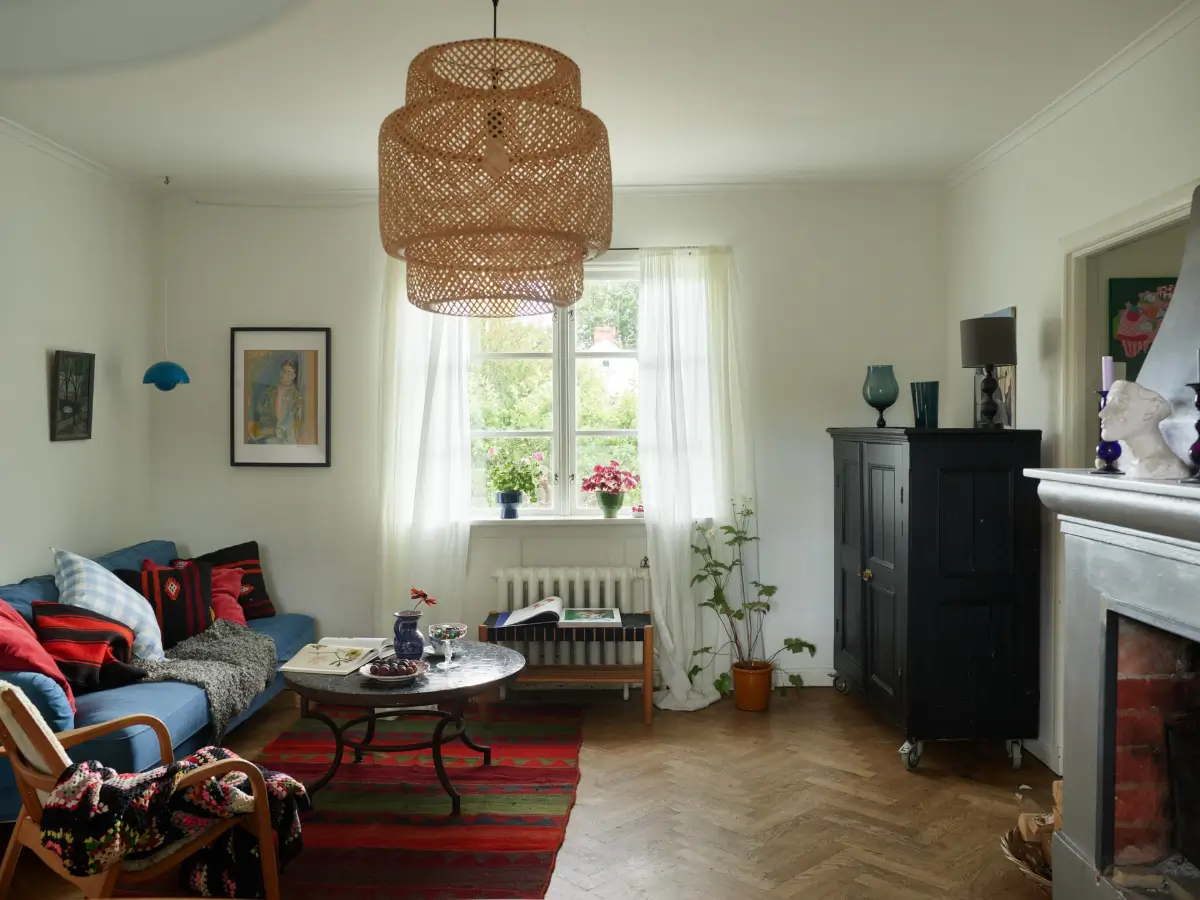 A Well-Preserved 1920s House with a Green Kitchen in Stockholm 12 living room parquet herringbone floor