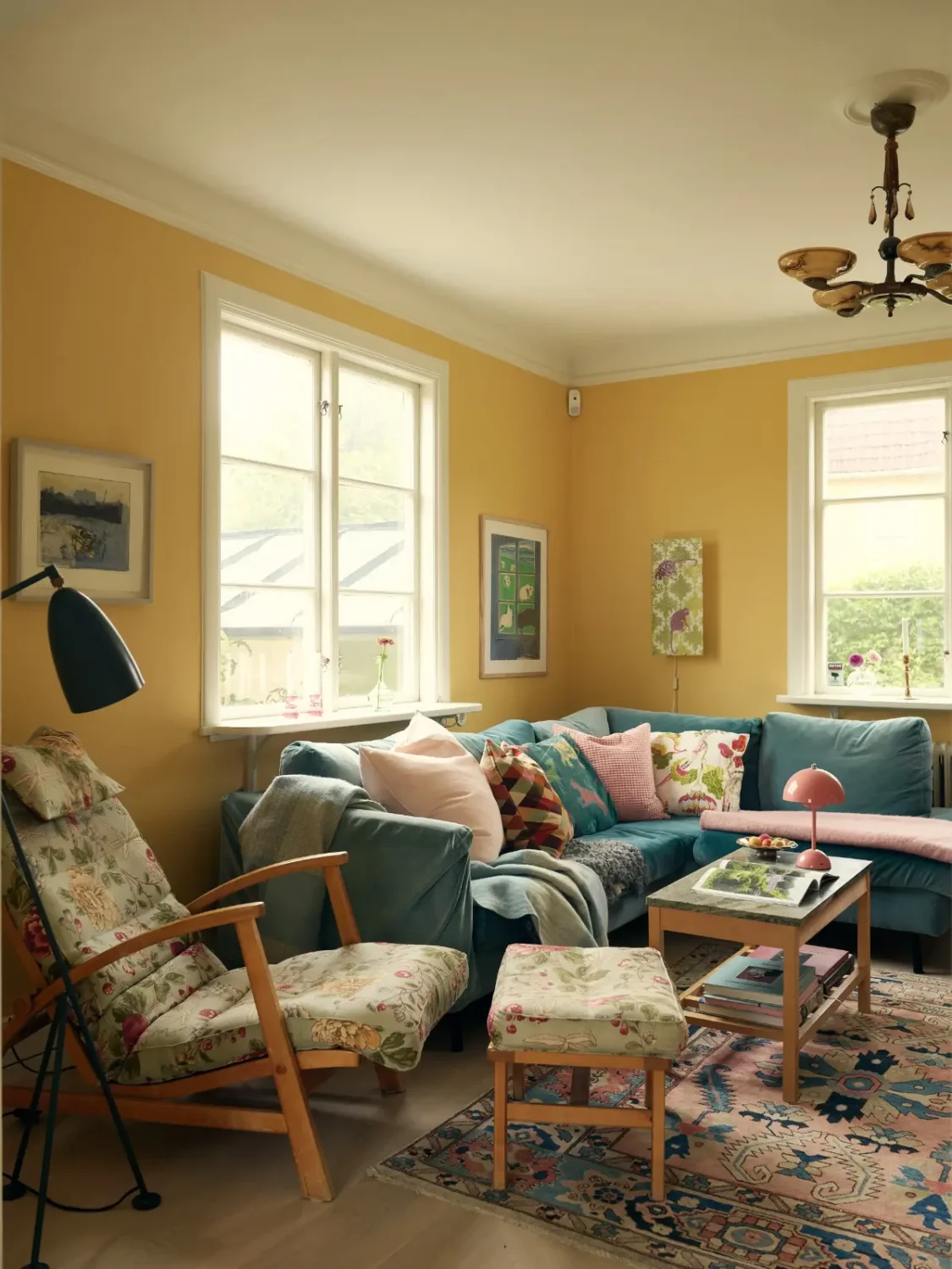 A Cheerful Color Palette in an Early 20th Century Villa in Stockholm 2 living room sunny yellow walls blue sofa nordroom