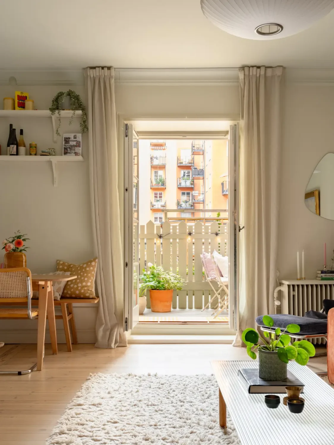 A Light Color Palette and a Charming Private Patio in a Stockholm Apartment 7 living room terrace