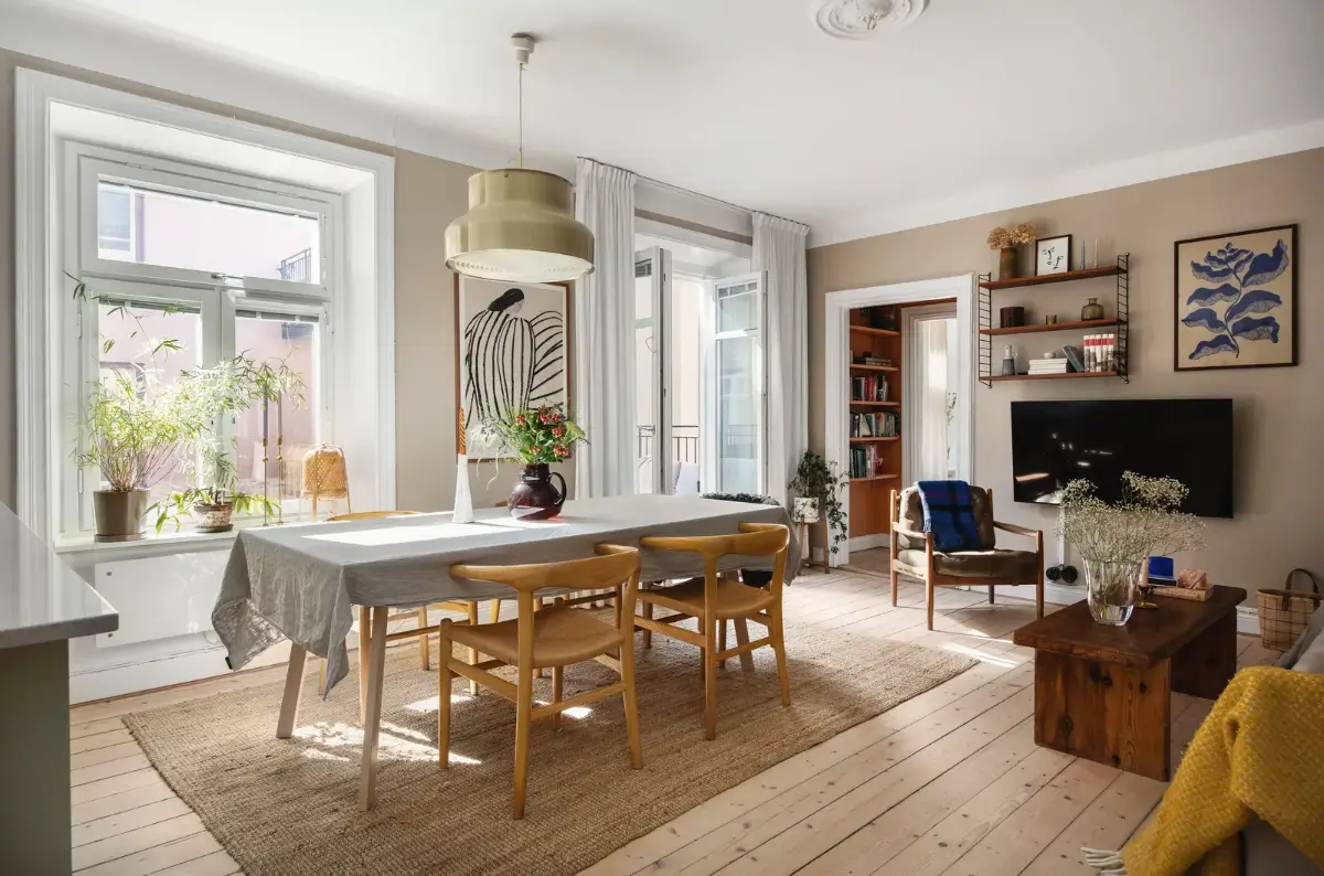 Warm Colors and an Open-Plan Living Space in a Stockholm Apartment 7 living room warm beige walls wooden floor large dining table