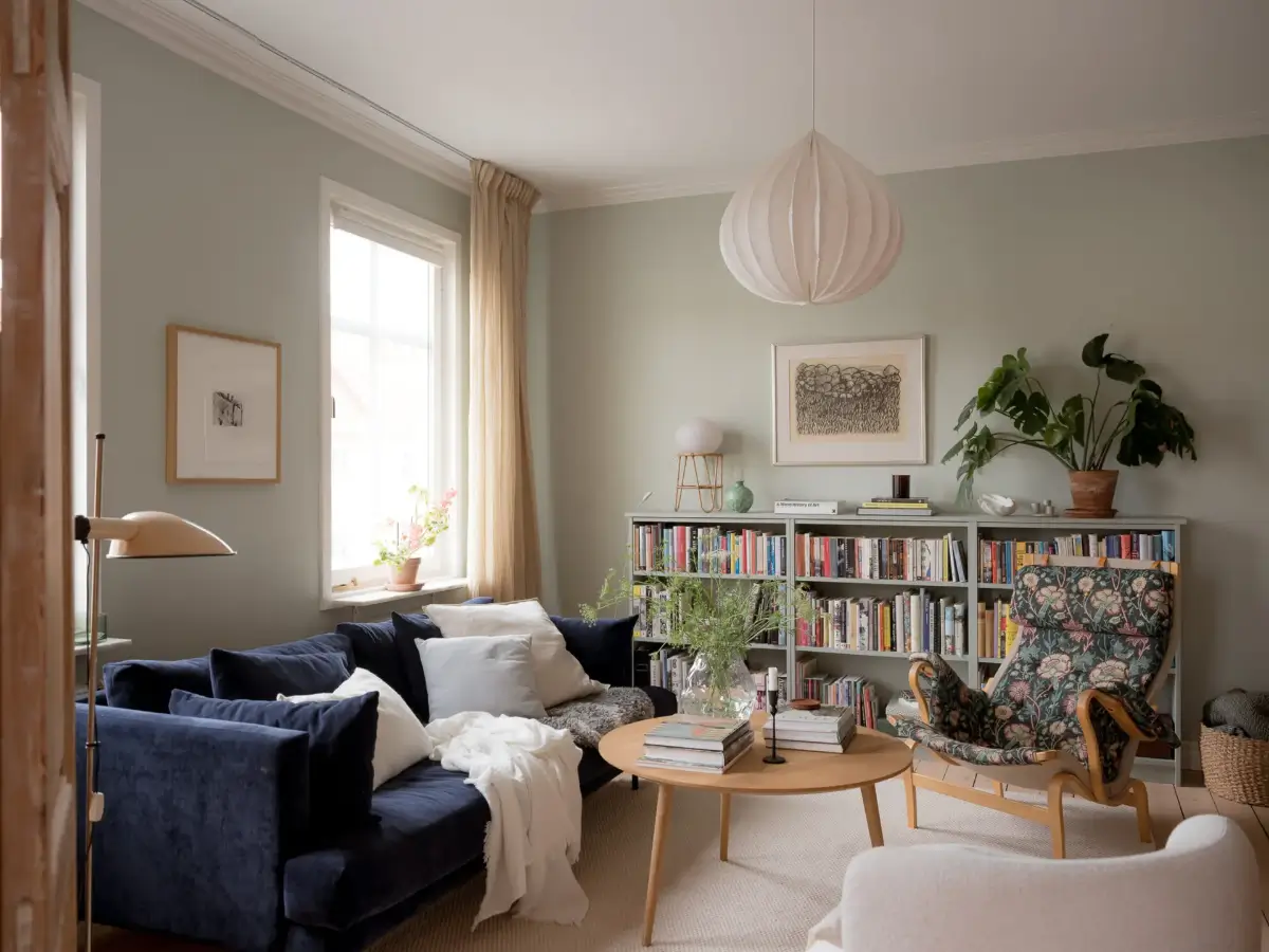 A Cozy Apartment with Exposed Brick and Period Details 3 living room william morris armchair