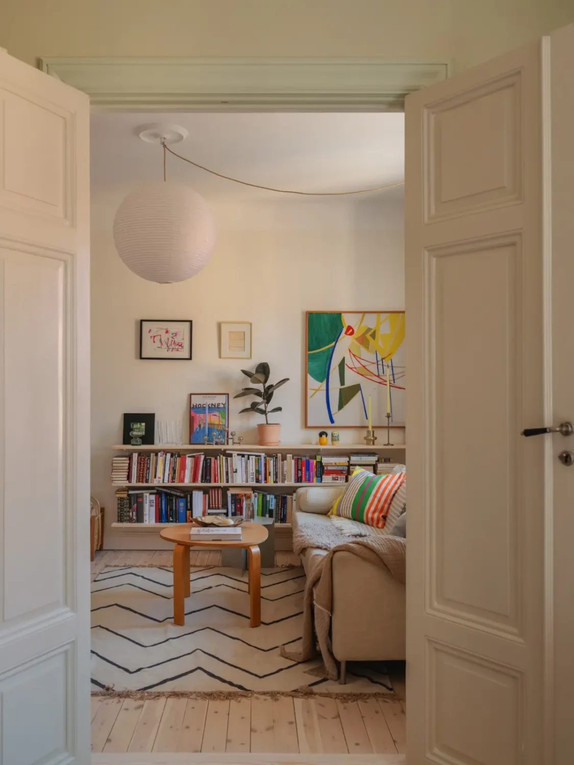 A Bright Apartment Where Historic Character Meets Contemporary Design 8 living room with bookshelves