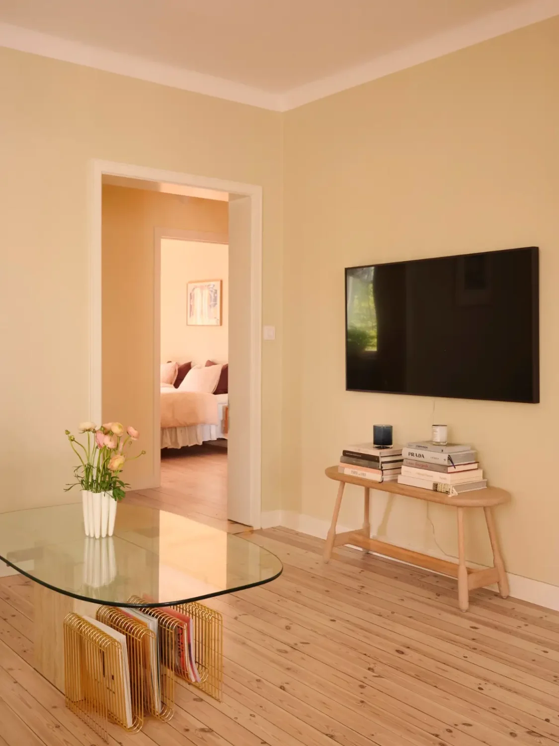 Soft Beige Interiors with the Occasional Bright Color Pop in Stockholm 10 living room wooden floor