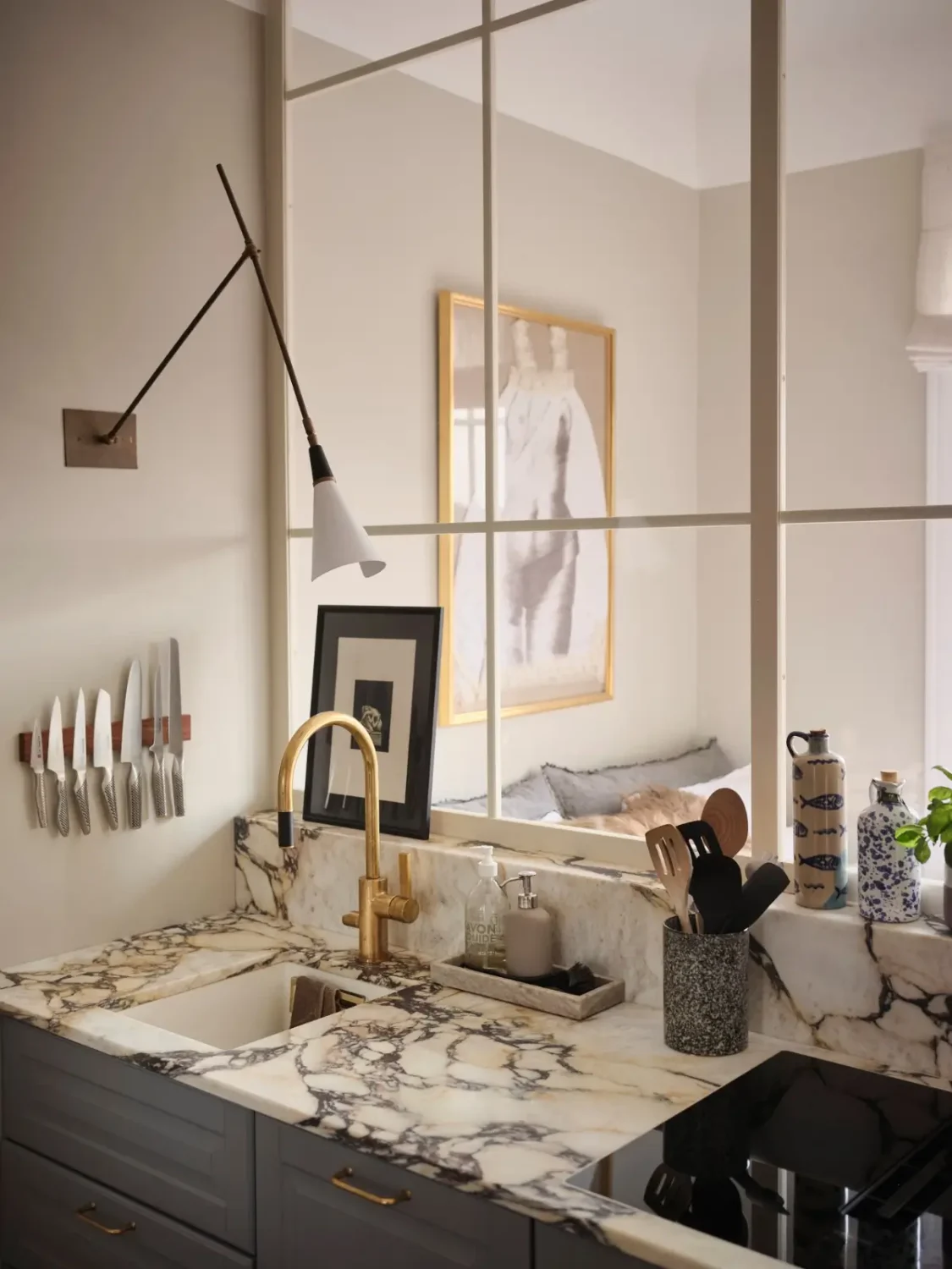 Warm Pink Walls and a Glass Room Divider in a Small Stockholm Apartment 20 marble kitchen countertop glass wall nordroom