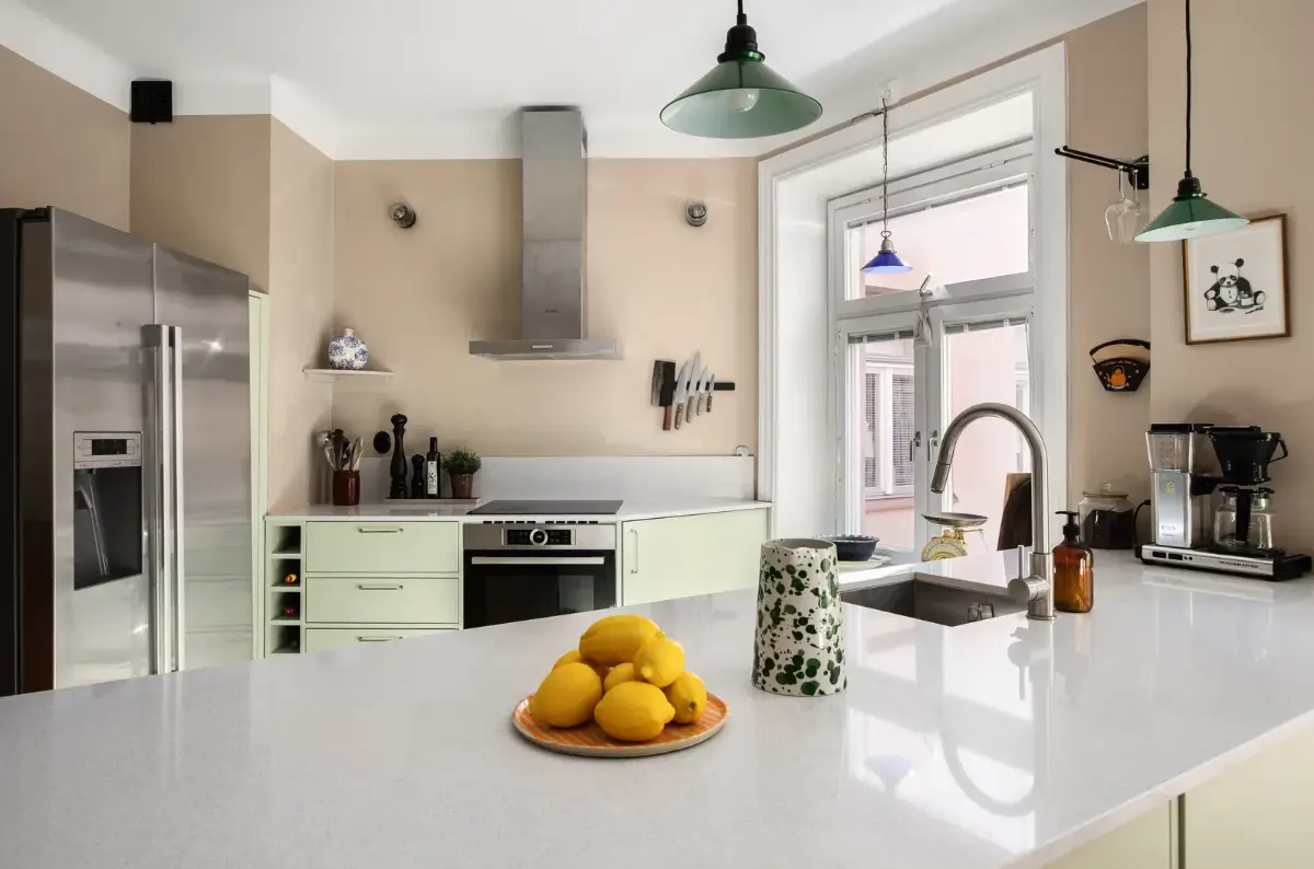 Warm Colors and an Open-Plan Living Space in a Stockholm Apartment 3 mint green kitchen