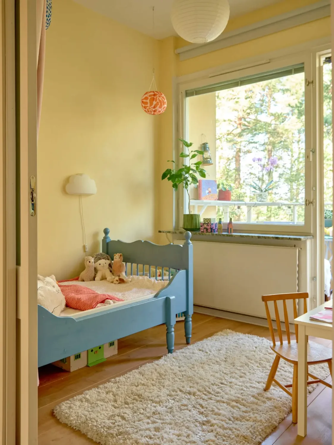 A Colorful and Cozy Midcentury Apartment in Stockholm 20 nursery light yellow walls