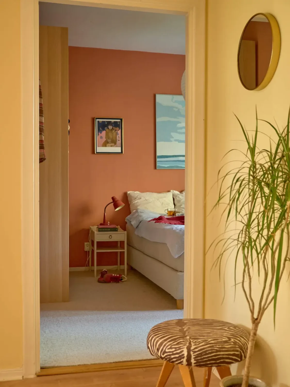 A Colorful and Cozy Midcentury Apartment in Stockholm 18 peek into bedroom