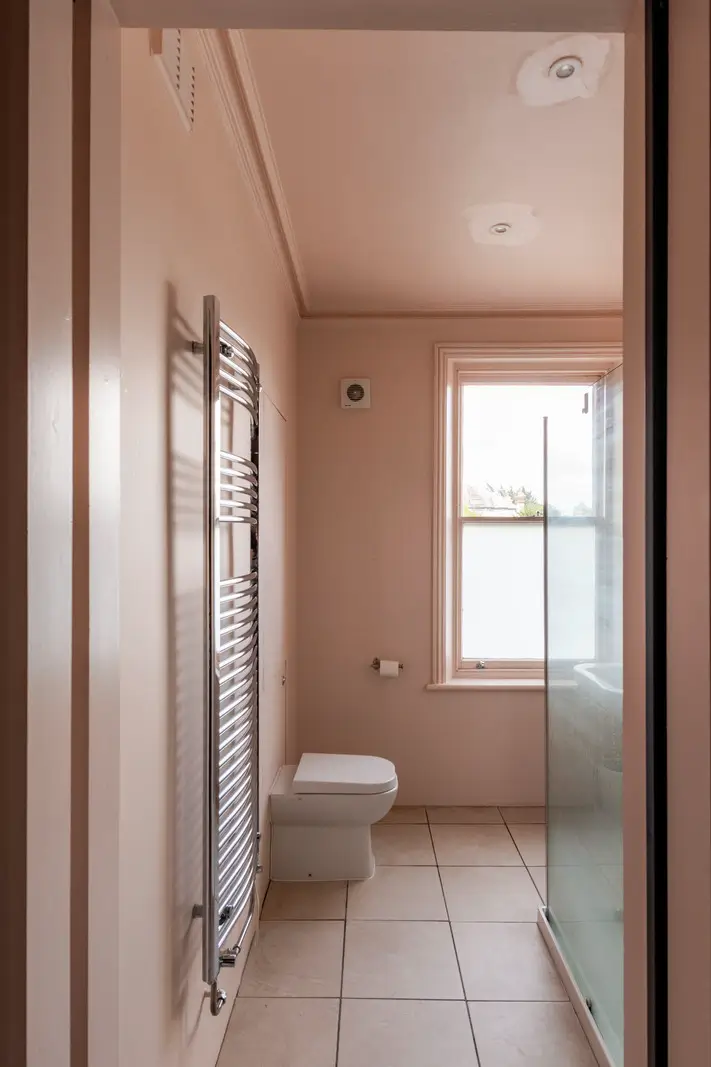 A Dramatic Color Palette in a Large Victorian Family Townhouse 26 pink bathroom