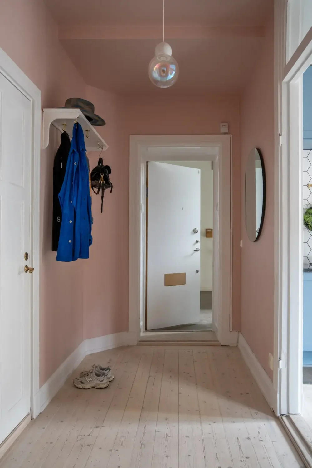 A Light Turn-of-the-Century Apartment with a Blue Kitchen 25 pink hallway A Light Turn-of-the-Century Apartment with a Blue Kitchen