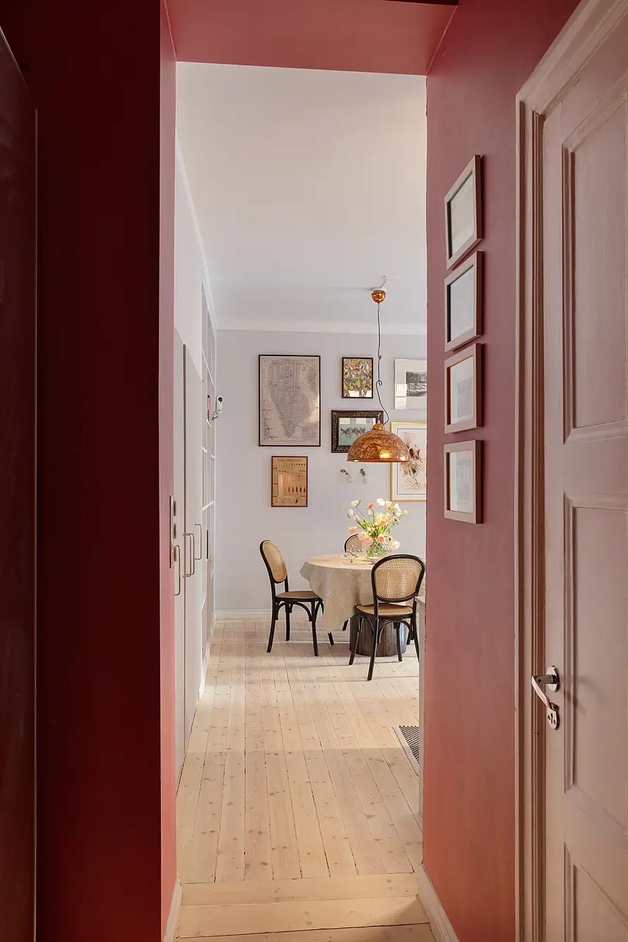 Red and Blue Color Accents in an Open-Plan Stockholm Apartment 17 red hall view into living room