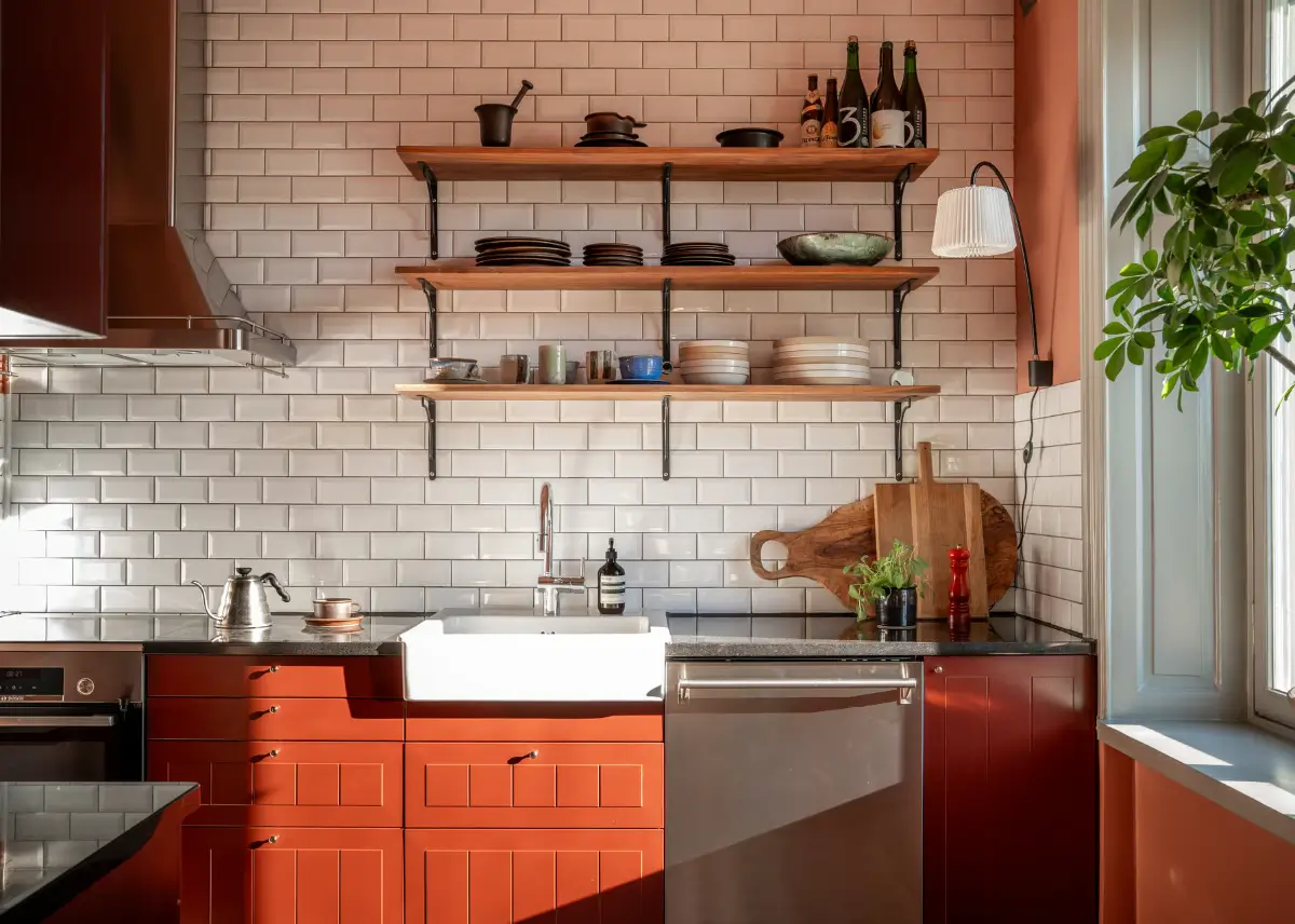 Historic Elegance and a French-Style Kitchen and Bathroom in a Stockholm Apartment 15 red kitchen white backsplash tiles