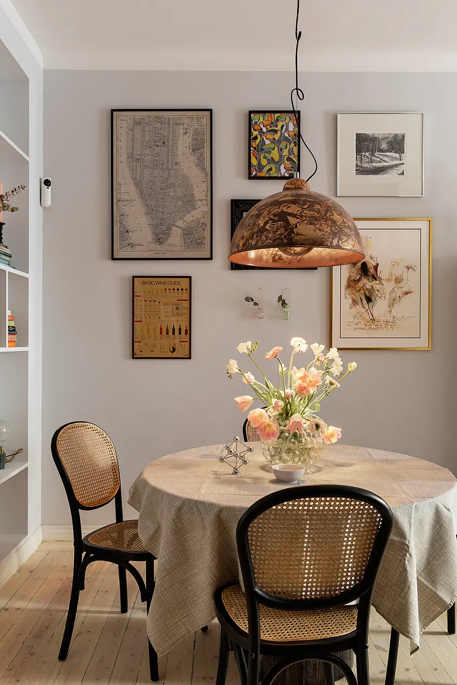 Red and Blue Color Accents in an Open-Plan Stockholm Apartment 9 round dining table light gray walls