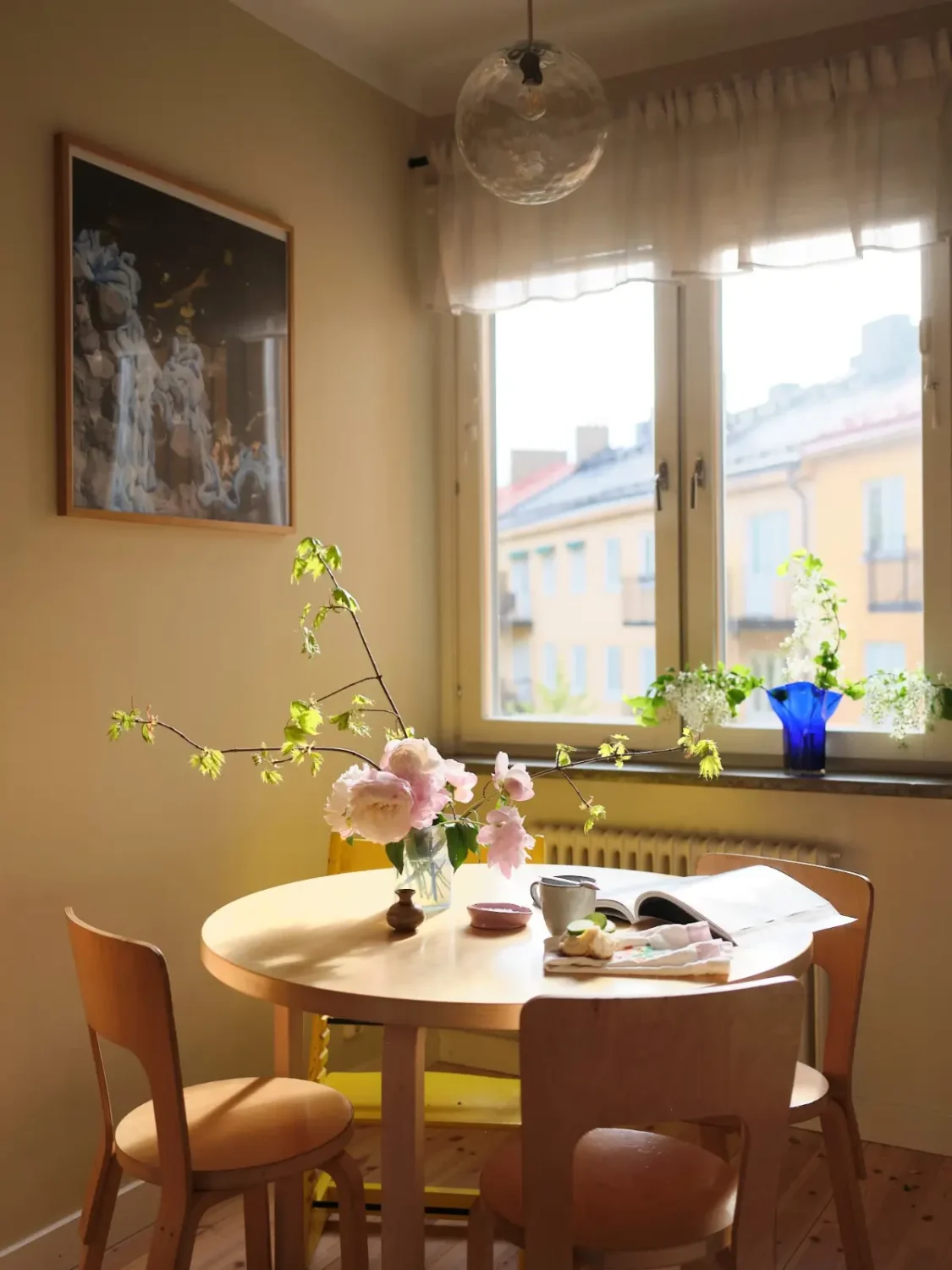 Soft Beige Interiors with the Occasional Bright Color Pop in Stockholm 15 round kitchen table