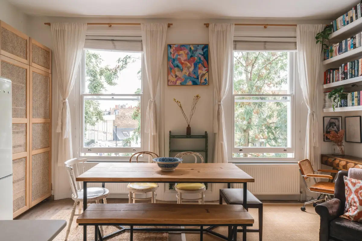 A Bright and Cozy One-Bedroom Apartment in London 2 rustic industrial dining table with bench and vintage chairs