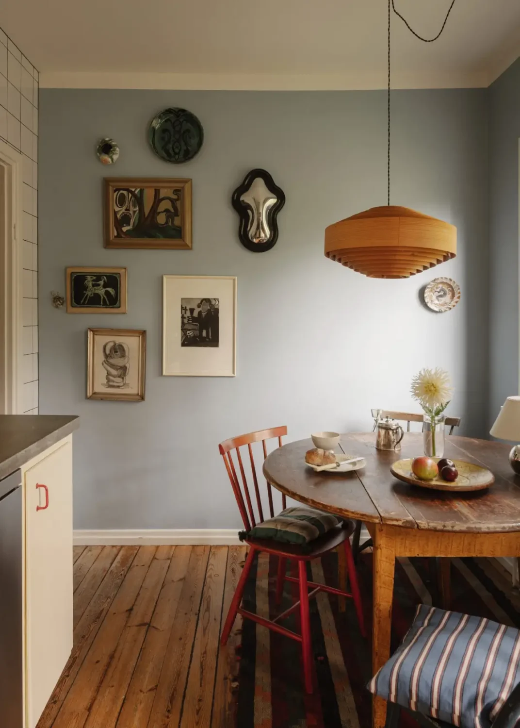 A Pink 1930s Studio Apartment with a Lovely Private Garden 14 rustic kitchen table blue wall