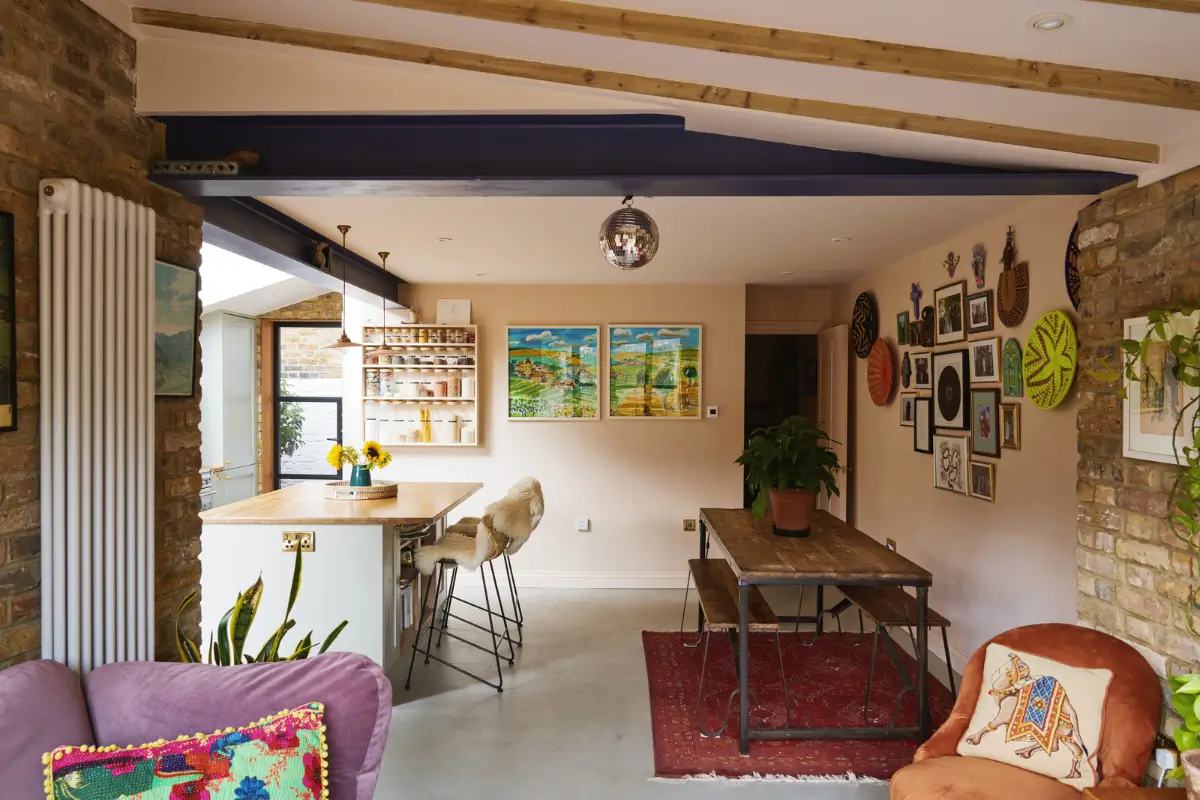 An Extended Victorian Apartment with Exposed Brick Walls 6 rustic wooden dining table extened living space
