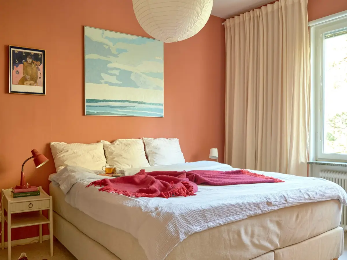 A Colorful and Cozy Midcentury Apartment in Stockholm 14 scandi bedroom terracotta walls