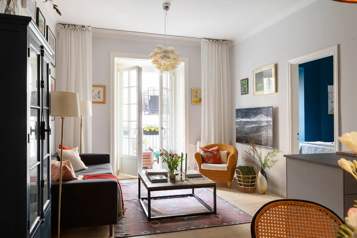 Red and Blue Color Accents in an Open-Plan Stockholm Apartment 2 scandi living room light gray walls nordroom