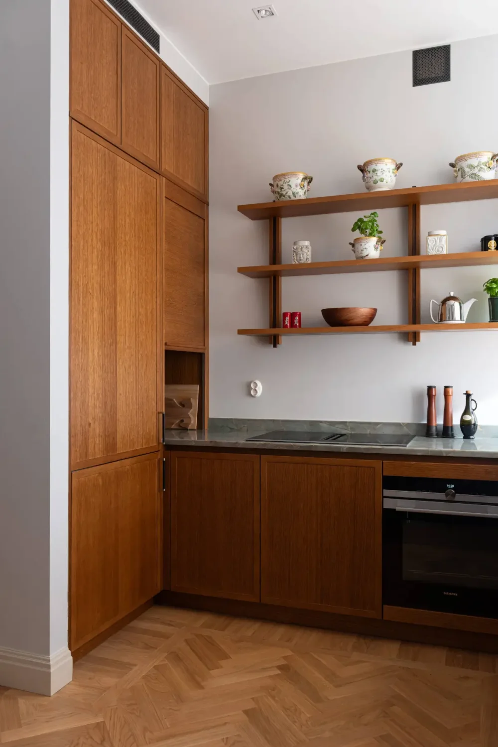 A Luxurious Family Apartment with a Dramatic Black Bathroom 9 scandinavian kitchen wooden shelves