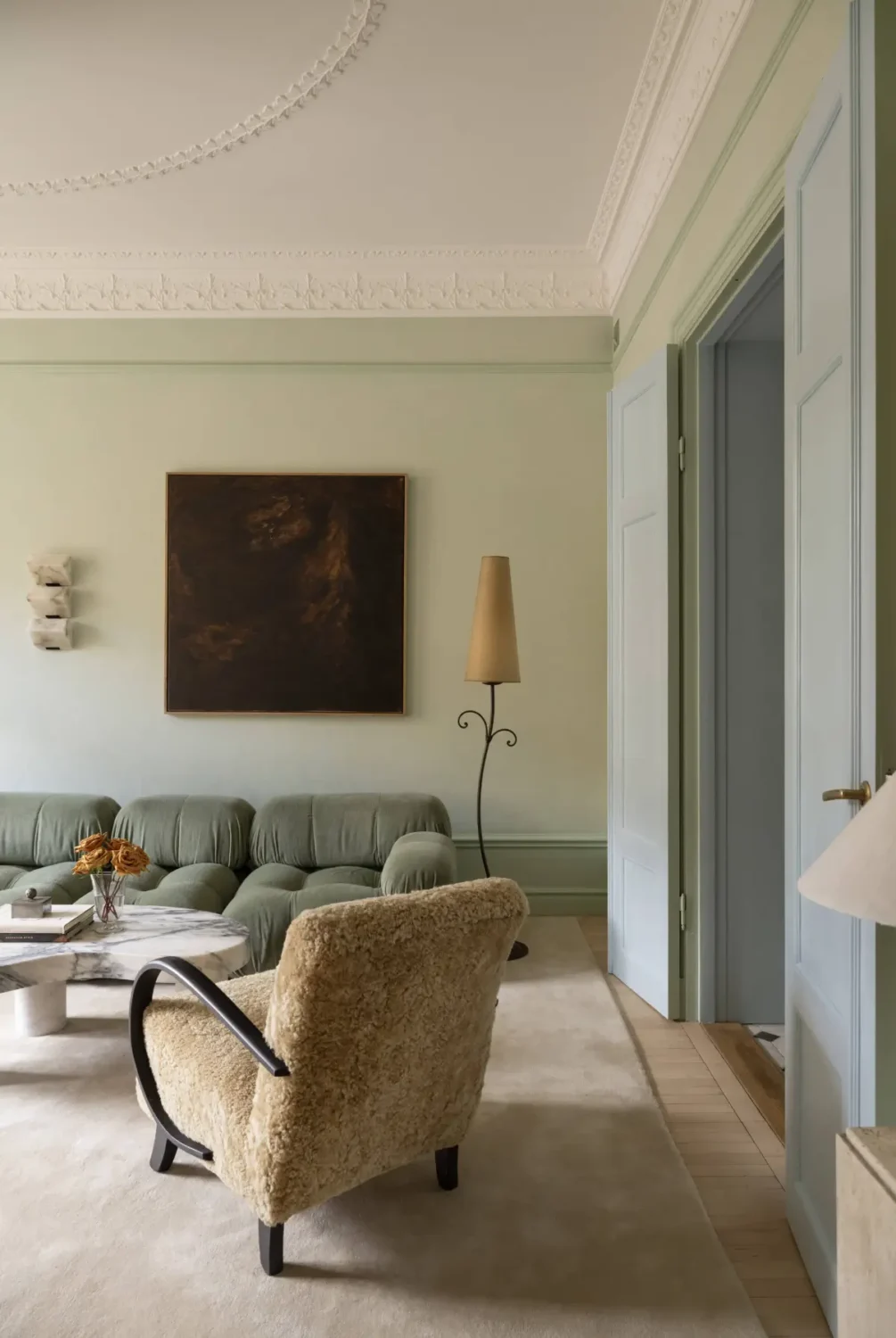 Luxurious Design and Period Features in a Stunning Stockholm Apartment 2 scandinavian living room stucco light green walls nordroom