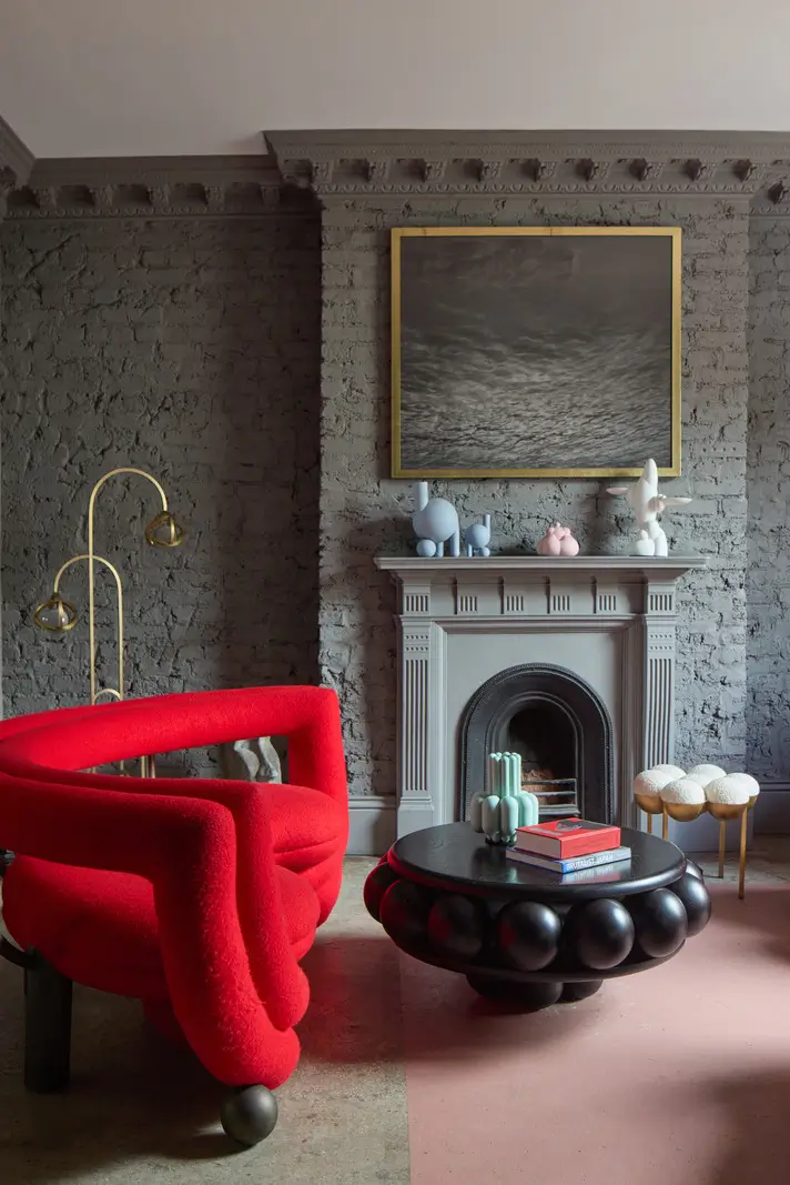 Victorian Grandeur Meets Modern Design in a Camden Square Townhouse 3 sitting room gray brick walls fireplace