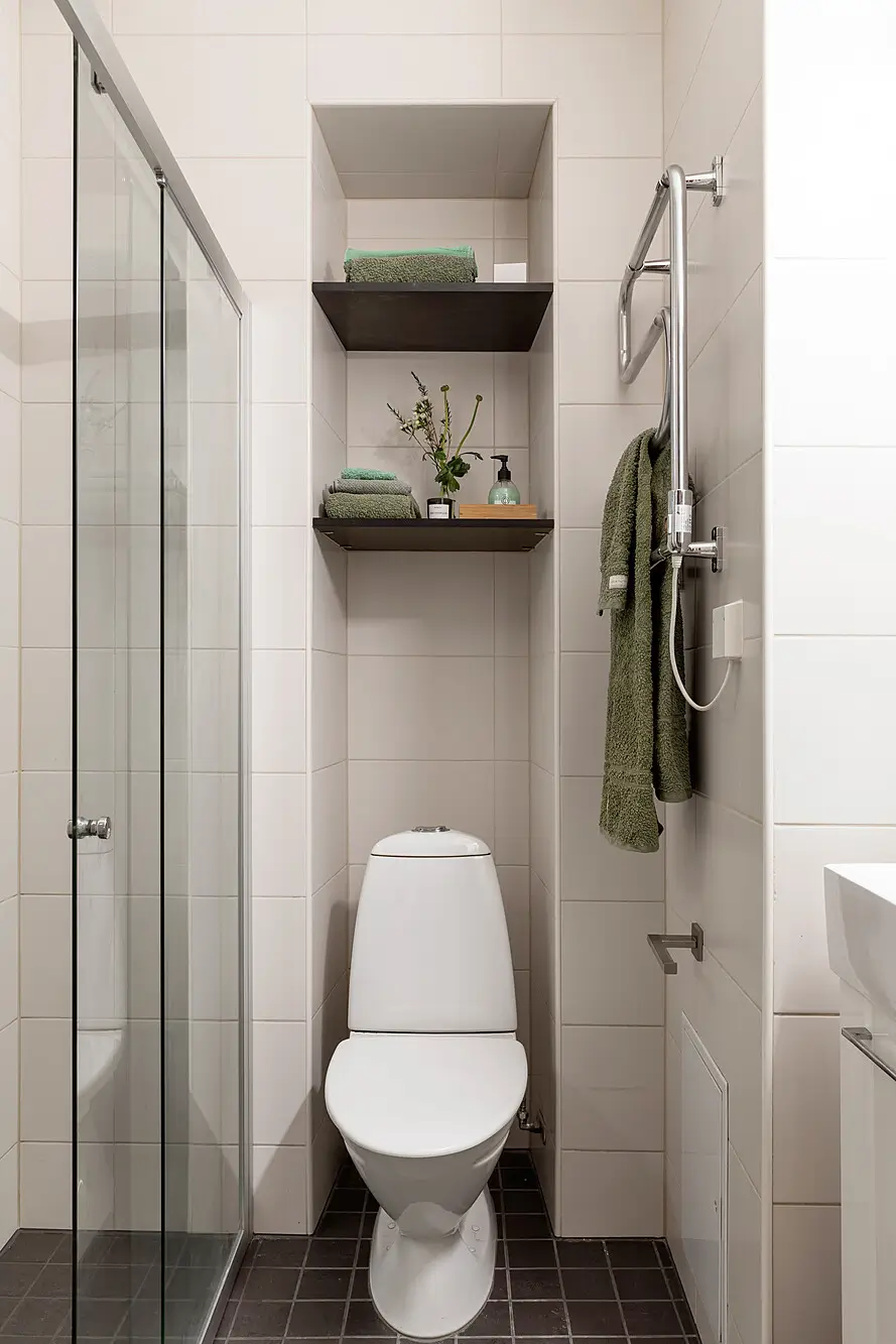 Red and Blue Color Accents in an Open-Plan Stockholm Apartment 18 small bathroom white tiles