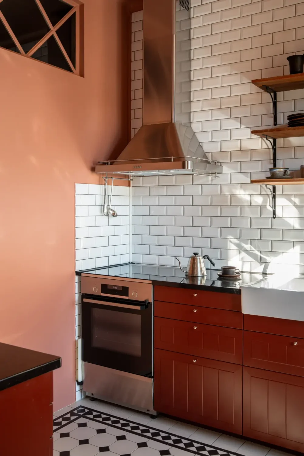Historic Elegance and a French-Style Kitchen and Bathroom in a Stockholm Apartment 20 small kitchen pink walls red cabinets white tiles nordroom