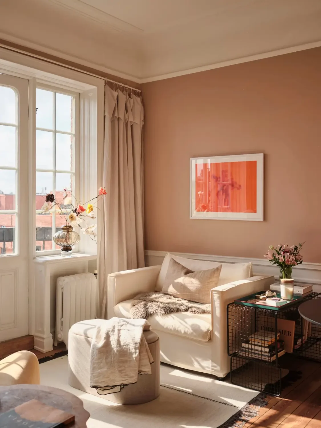 Warm Pink Walls and a Glass Room Divider in a Small Stockholm Apartment 2 small pink living room loveseat nordroom