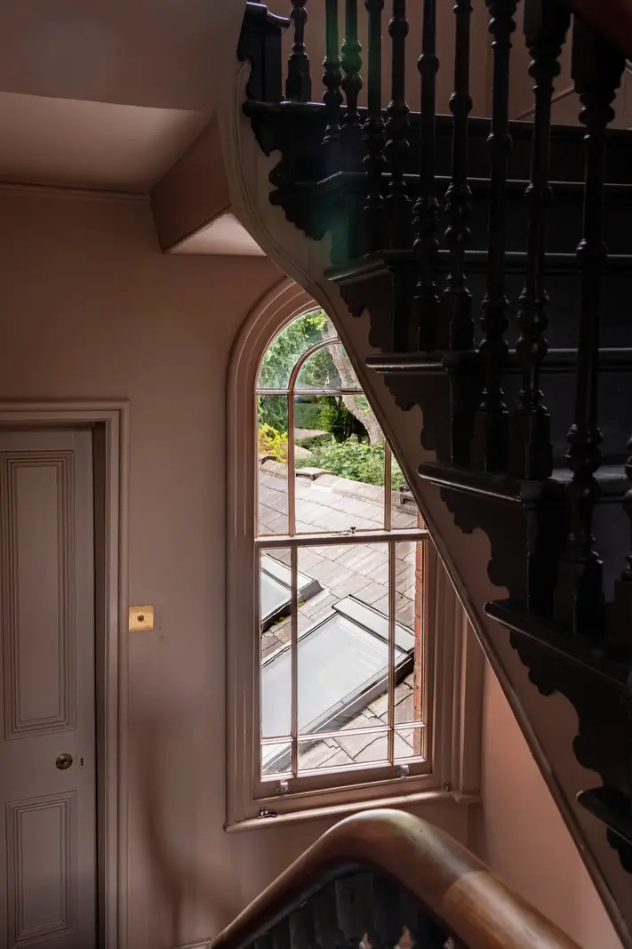 A Dramatic Color Palette in a Large Victorian Family Townhouse 35 staircase arched window