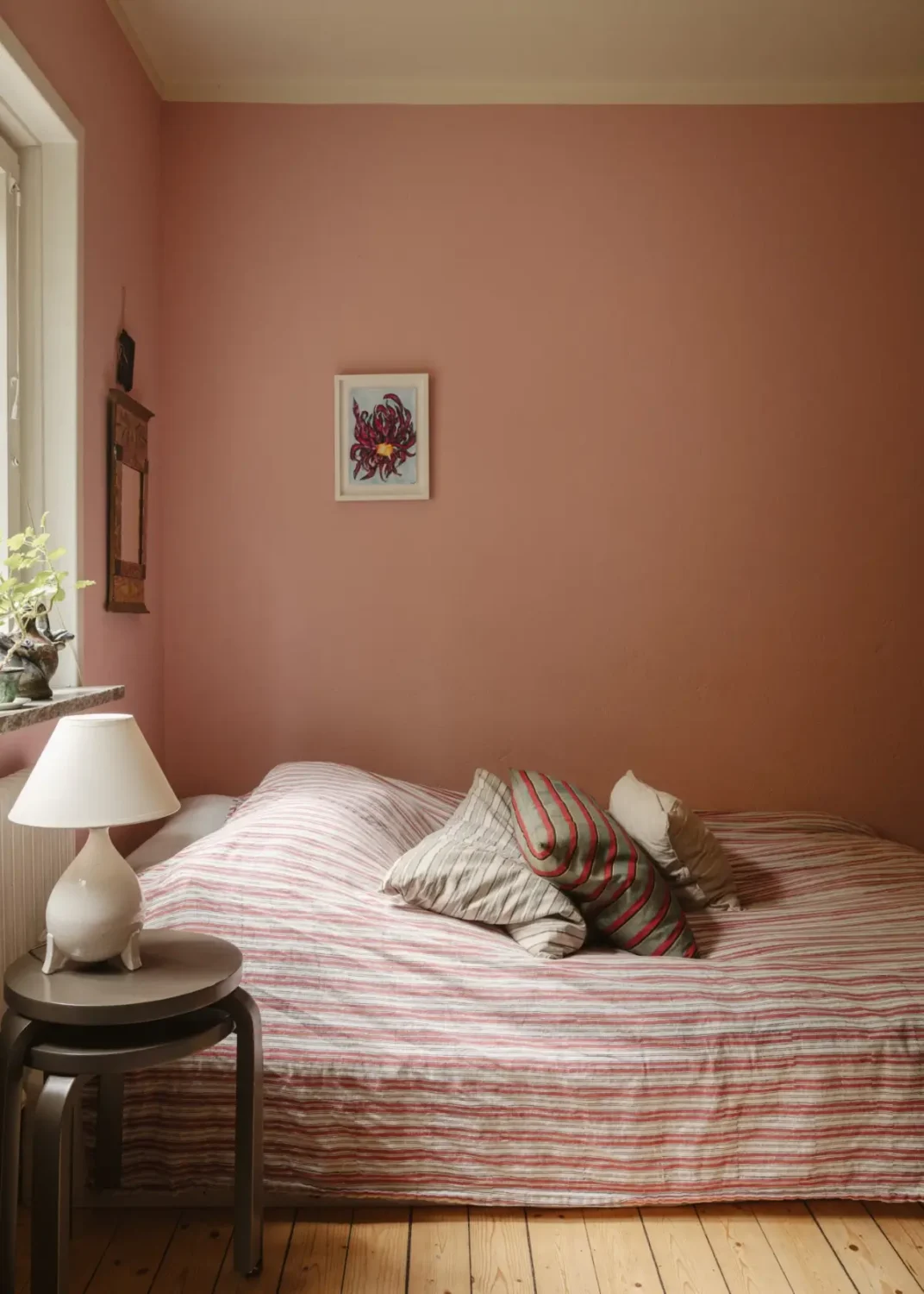 A Pink 1930s Studio Apartment with a Lovely Private Garden 6 striped pink bedding