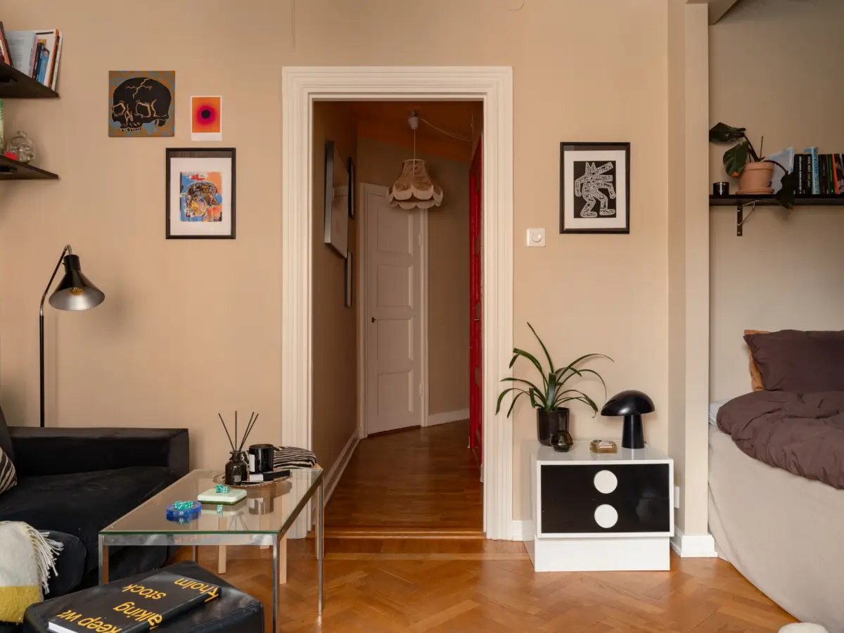 Warm Beige Walls and Practical Niches in a 1920s Studio Apartment 4 studio apartment parquet floor