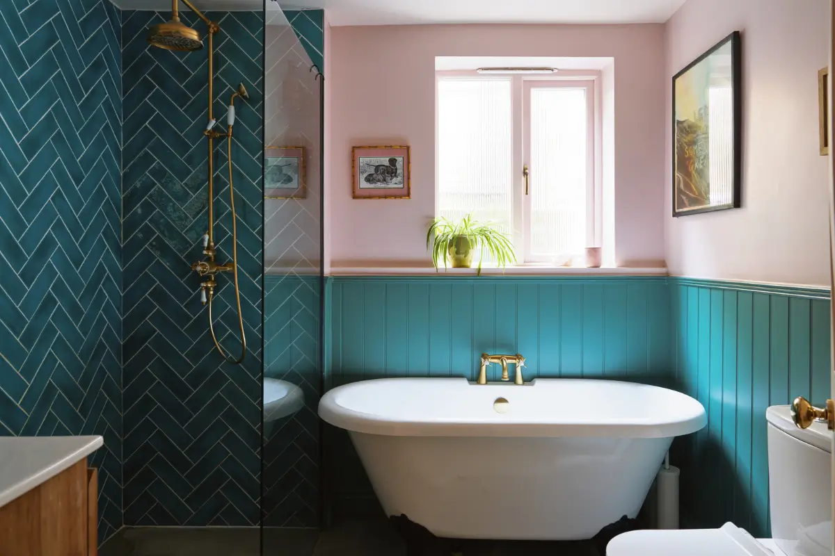 An Extended Victorian Apartment with Exposed Brick Walls 16 teal and pink bathroom with freestanding bath
