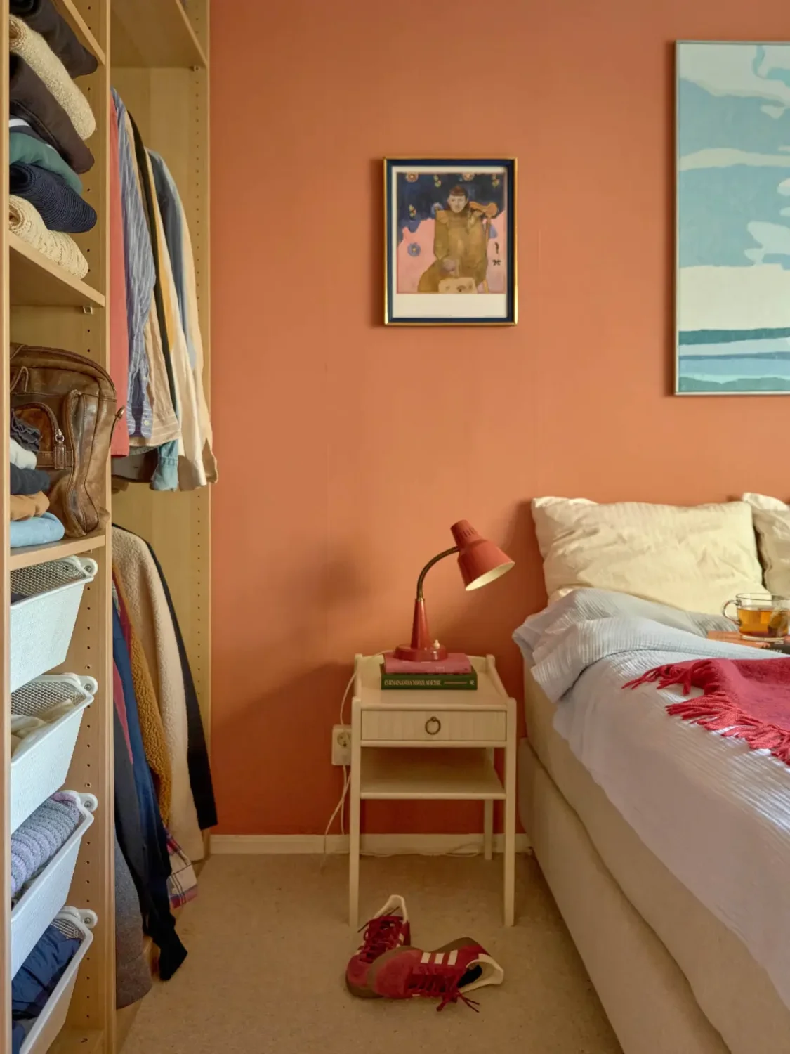 A Colorful and Cozy Midcentury Apartment in Stockholm 17 terracotta bedroom open wardrobe