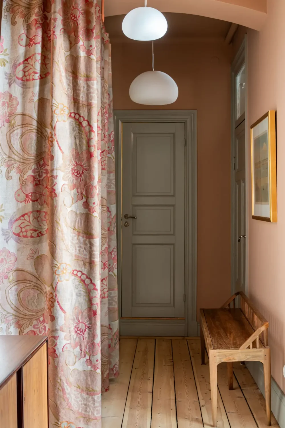 Historic Elegance and a French-Style Kitchen and Bathroom in a Stockholm Apartment 36 terracotta-colored hall storage behind curtain nordroom