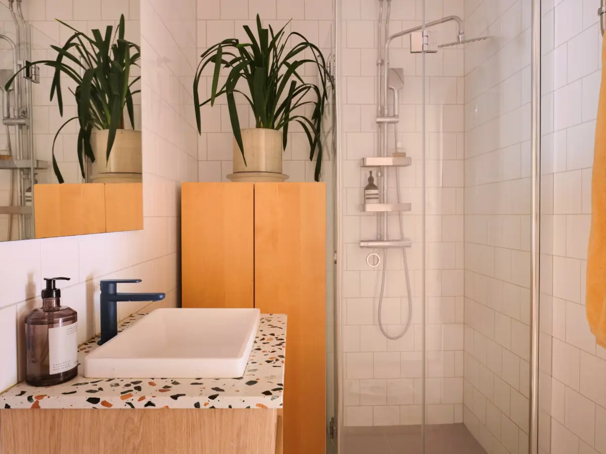 Soft Beige Interiors with the Occasional Bright Color Pop in Stockholm 28 terrazzo bathroom vanity top white tiles