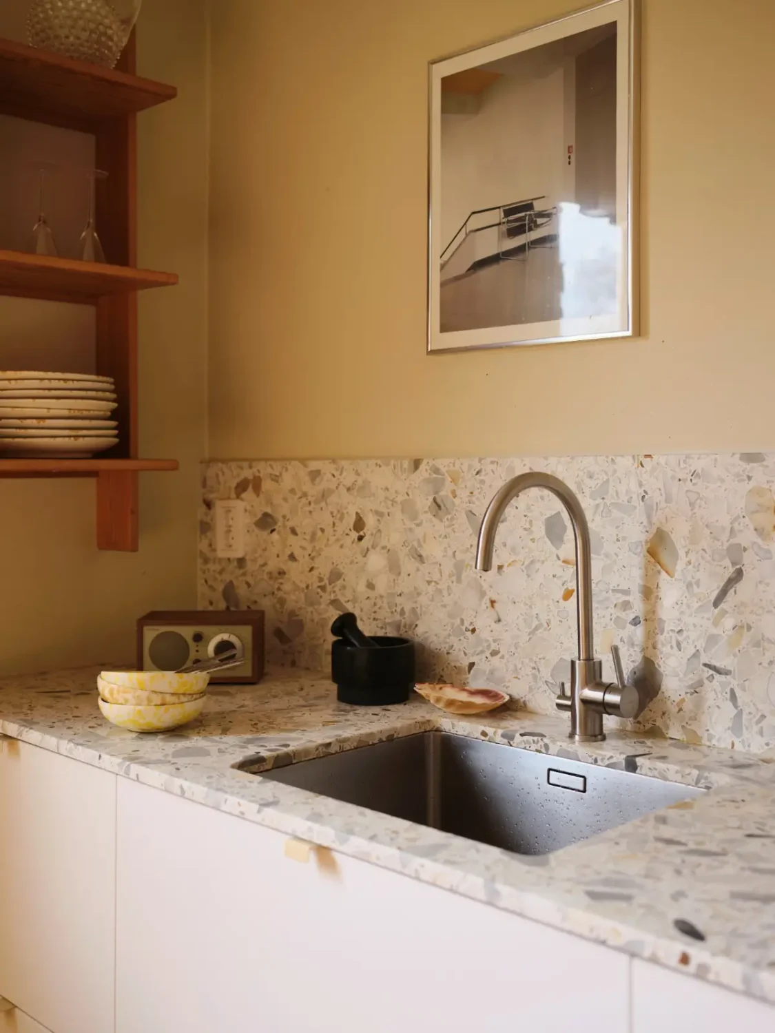 Soft Beige Interiors with the Occasional Bright Color Pop in Stockholm 14 terrazzo kitchen countertop